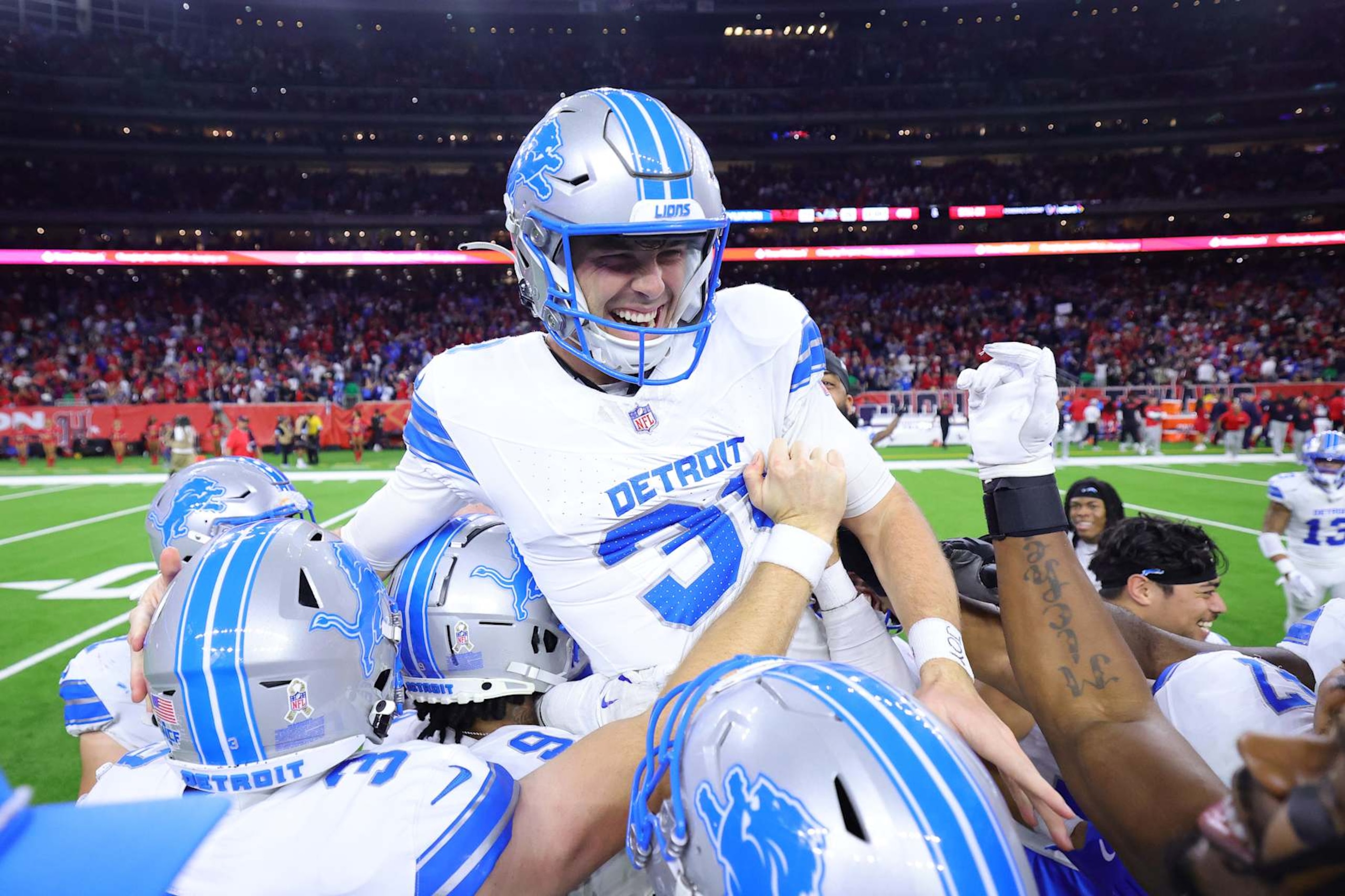 HOUSTON, TEXAS - NOVEMBER 10: Jake Bates #39 of the Detroit Lions celebrates with teammates after kicking the winning field goal during the fourth quarter against the Houston Texans at NRG Stadium on November 10, 2024 in Houston, Texas. (Photo by Alex Slitz/Getty Images)