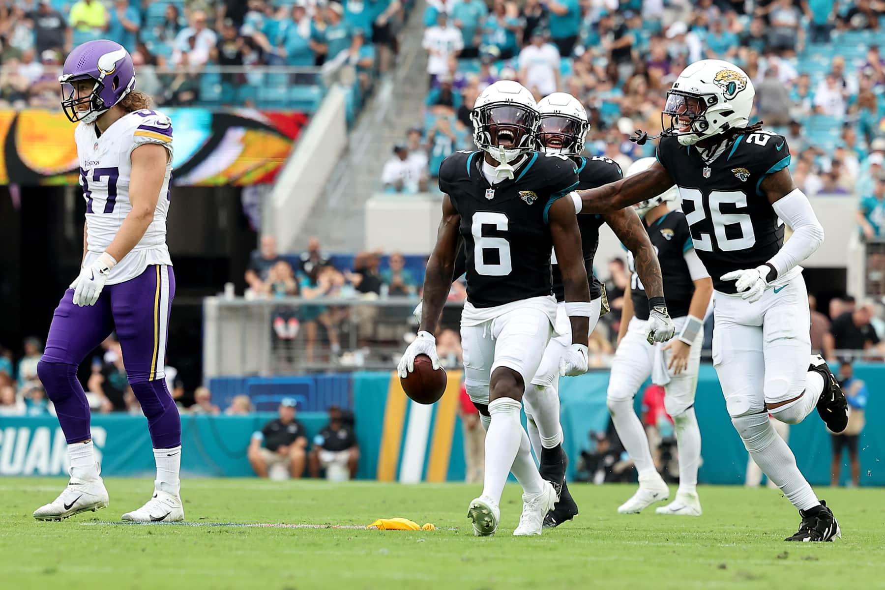 JACKSONVILLE, FLORIDA - NOVEMBER 10: Darnell Savage #6 of the Jacksonville Jaguars celebrates after his interception against the Minnesota Vikings with Antonio Johnson #26 during the third quarter at EverBank Stadium on November 10, 2024 in Jacksonville, Florida. (Photo by Mike Carlson/Getty Images)