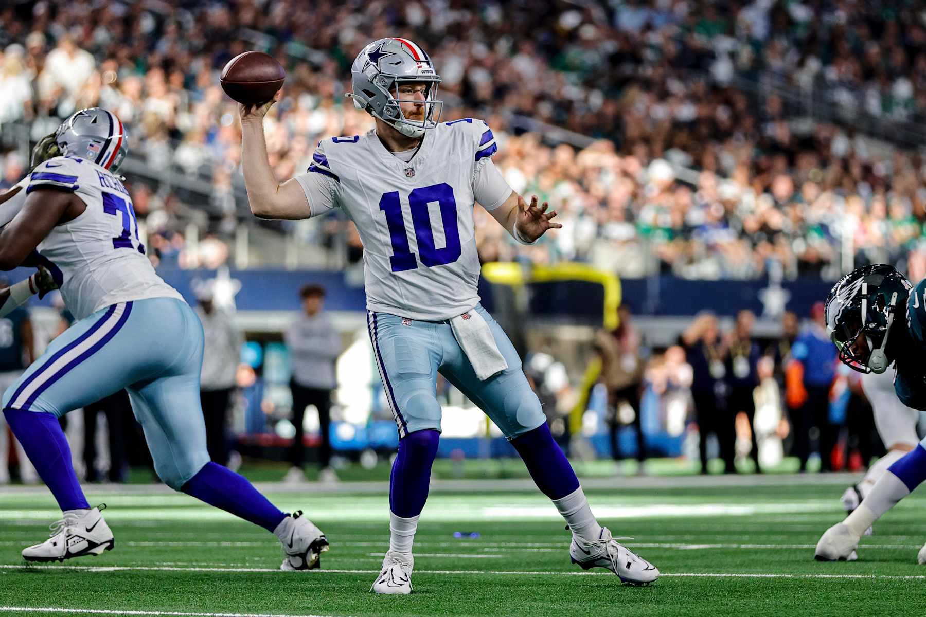 ARLINGTON, TX - NOVEMBER 10: Dallas Cowboys quarterback Cooper Rush (10) looks for a receiver during the game between the Dallas Cowboys and the Philadelphia Eagles on November 10, 2024 at AT&T Stadium in Arlington, Texas. (Photo by Matthew Pearce/Icon Sportswire via Getty Images)