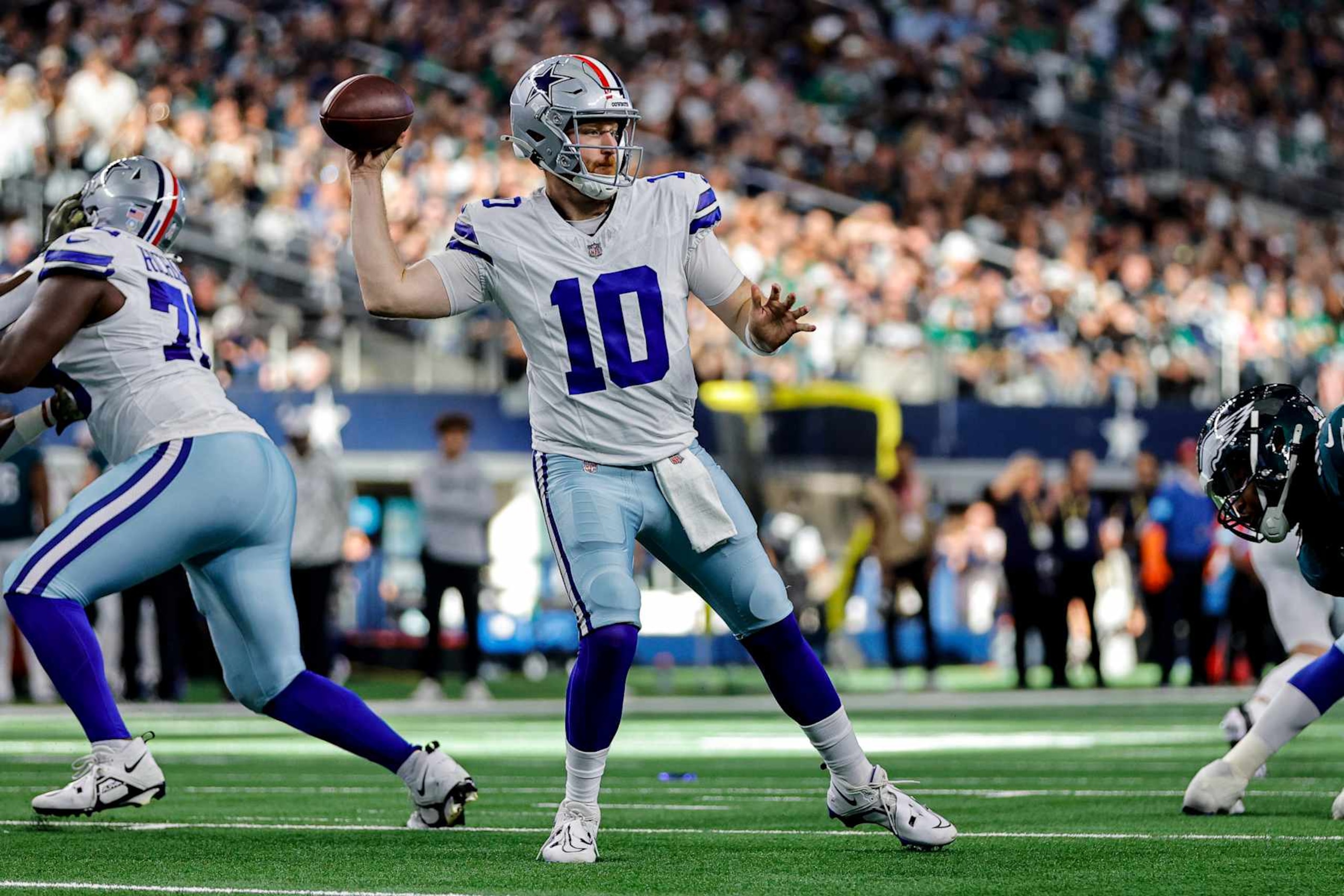 ARLINGTON, TX - NOVEMBER 10: Dallas Cowboys quarterback Cooper Rush (10) looks for a receiver during the game between the Dallas Cowboys and the Philadelphia Eagles on November 10, 2024 at AT&T Stadium in Arlington, Texas. (Photo by Matthew Pearce/Icon Sportswire via Getty Images)
