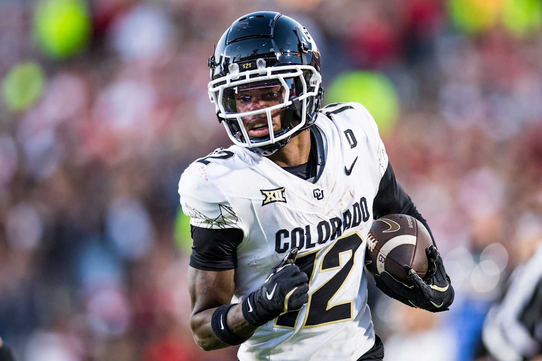 LUBBOCK, TEXAS - NOVEMBER 09: Travis Hunter #12 of the Colorado Buffaloes runs for a touchdown during the second half of the game against the Texas Tech Red Raiders at Jones AT&T Stadium on November 09, 2024 in Lubbock, Texas. (Photo by John E. Moore III/Getty Images)