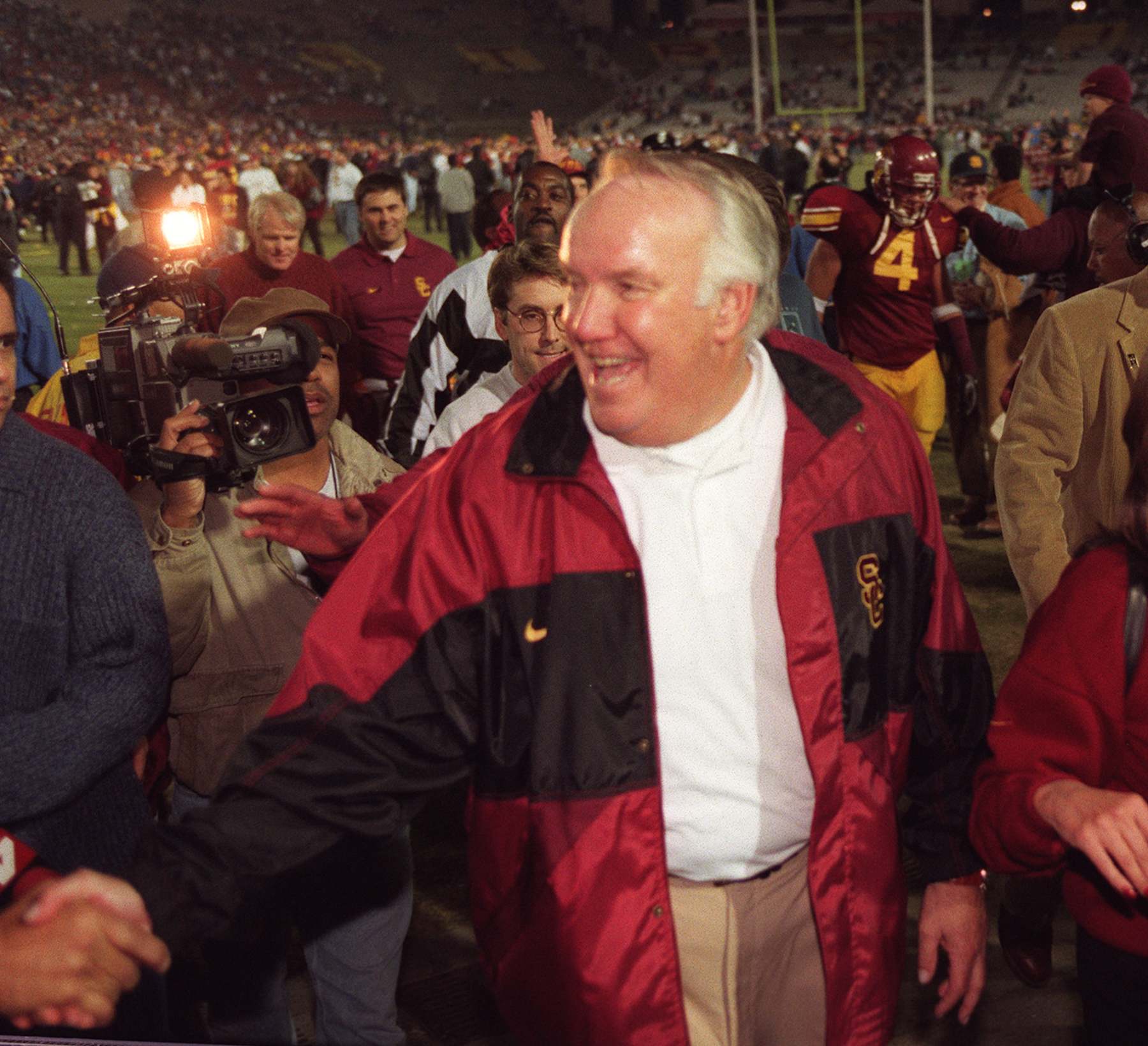 S.USCND.#16.1130.RG  USC coach John Robinson is all smiles as he heads off the Coliseum field after defeating Notre Dame in overtime.  (Photo by Robert Gauthier/Los Angeles Times via Getty Images)