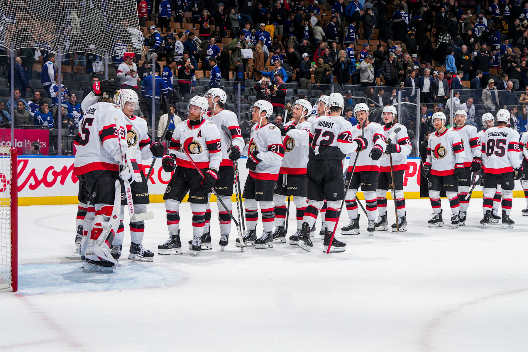 TORONTO, ON - NOVEMBER 12: Linus Ullmark #35 of the Ottawa Senators celebrates with teammates after defeating the Toronto Maple Leafs at Scotiabank Arena on November 12, 2024 in Toronto, Ontario, Canada. (Photo by Mark Blinch/NHLI via Getty Images)