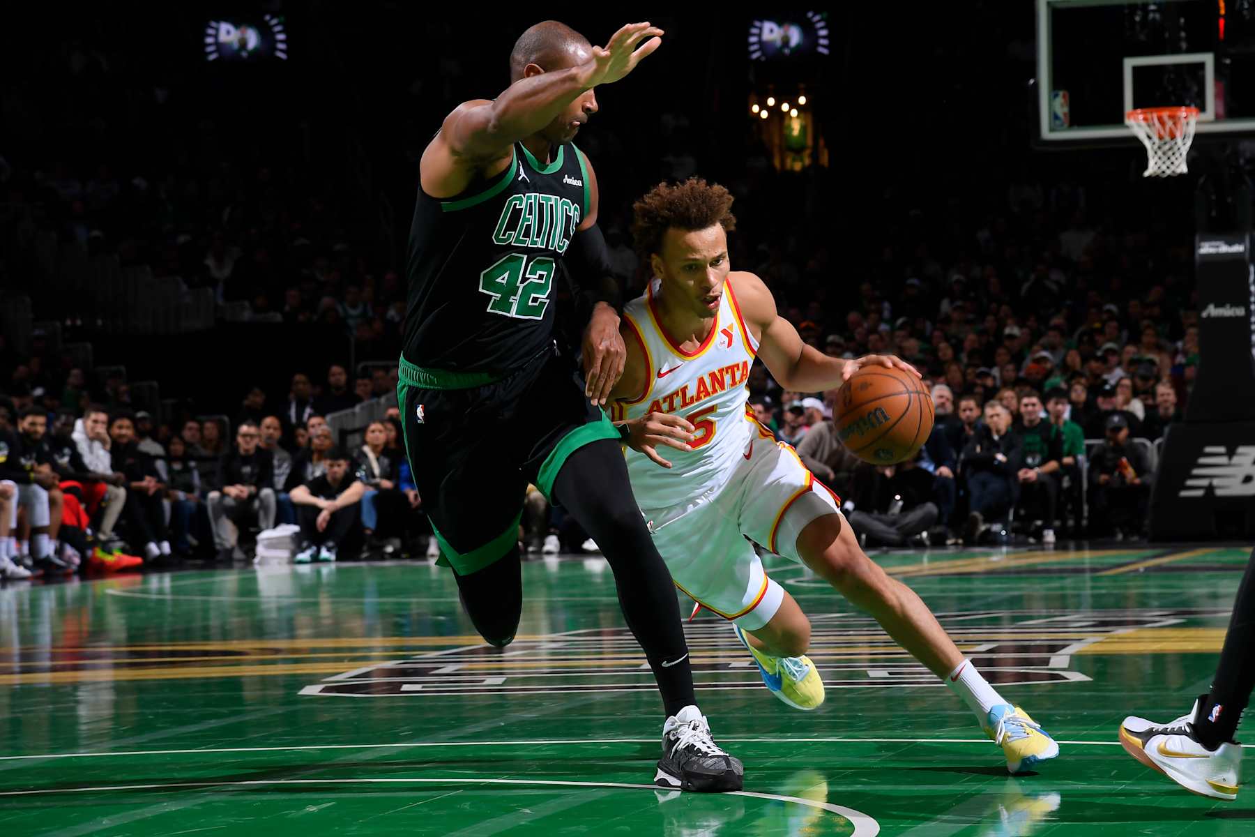 BOSTON, MA - NOVEMBER 12: Dyson Daniels #5 of the Atlanta Hawks drives to the basket during the game against the Boston Celtics during the Emirates NBA Cup game on November 12, 2024 at TD Garden in Boston, Massachusetts. NOTE TO USER: User expressly acknowledges and agrees that, by downloading and/or using this Photograph, user is consenting to the terms and conditions of the Getty Images License Agreement. Mandatory Copyright Notice: Copyright 2024 NBAE (Photo by Brian Babineau/NBAE via Getty Images) BOSTON, MA - NOVEMBER 12: Dyson Daniels #5 of the Atlanta Hawks drives to the basket during the game against the Boston Celtics during the Emirates NBA Cup game on November 12, 2024 at TD Garden in Boston, Massachusetts. NOTE TO USER: User expressly acknowledges and agrees that, by downloading and/or using this Photograph, user is consenting to the terms and conditions of the Getty Images License Agreement. Mandatory Copyright Notice: Copyright 2024 NBAE (Photo by Brian Babineau/NBAE via Getty Images)