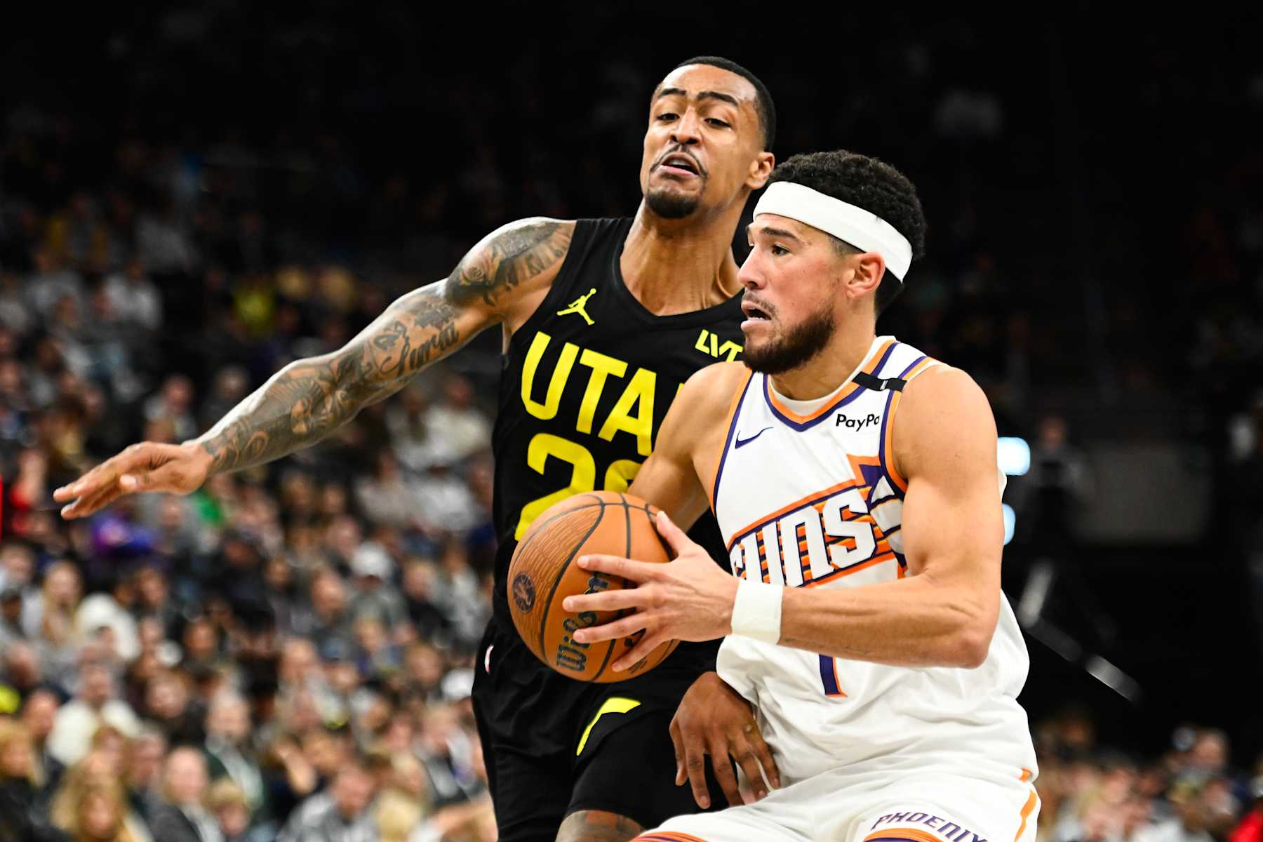 SALT LAKE CITY, UTAH - NOVEMBER 12: Devin Booker #1 of the Phoenix Suns drives into John Collins #20 of the Utah Jazz during the second half of a Emirates NBA Cup game at Delta Center on November 12, 2024 in Salt Lake City, Utah. NOTE TO USER: User expressly acknowledges and agrees that, by downloading and or using this photograph, User is consenting to the terms and conditions of the Getty Images License Agreement. (Photo by Alex Goodlett/Getty Images) SALT LAKE CITY, UTAH - NOVEMBER 12: Devin Booker #1 of the Phoenix Suns drives into John Collins #20 of the Utah Jazz during the second half of a Emirates NBA Cup game at Delta Center on November 12, 2024 in Salt Lake City, Utah. NOTE TO USER: User expressly acknowledges and agrees that, by downloading and or using this photograph, User is consenting to the terms and conditions of the Getty Images License Agreement. (Photo by Alex Goodlett/Getty Images)