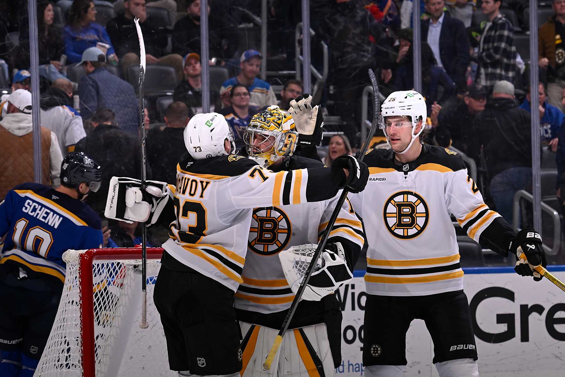 ST. LOUIS, MO - NOVEMBER 12: Charlie McAvoy #73 Jeremy Swayman #1 and Brandon Carlo #25 of the Boston Bruins celebrate after beating the St. Louis Blues 3-2 on November 12, 2024 at the Enterprise Center in St. Louis, Missouri. (Photo by Joe Puetz/NHLI via Getty Images)
