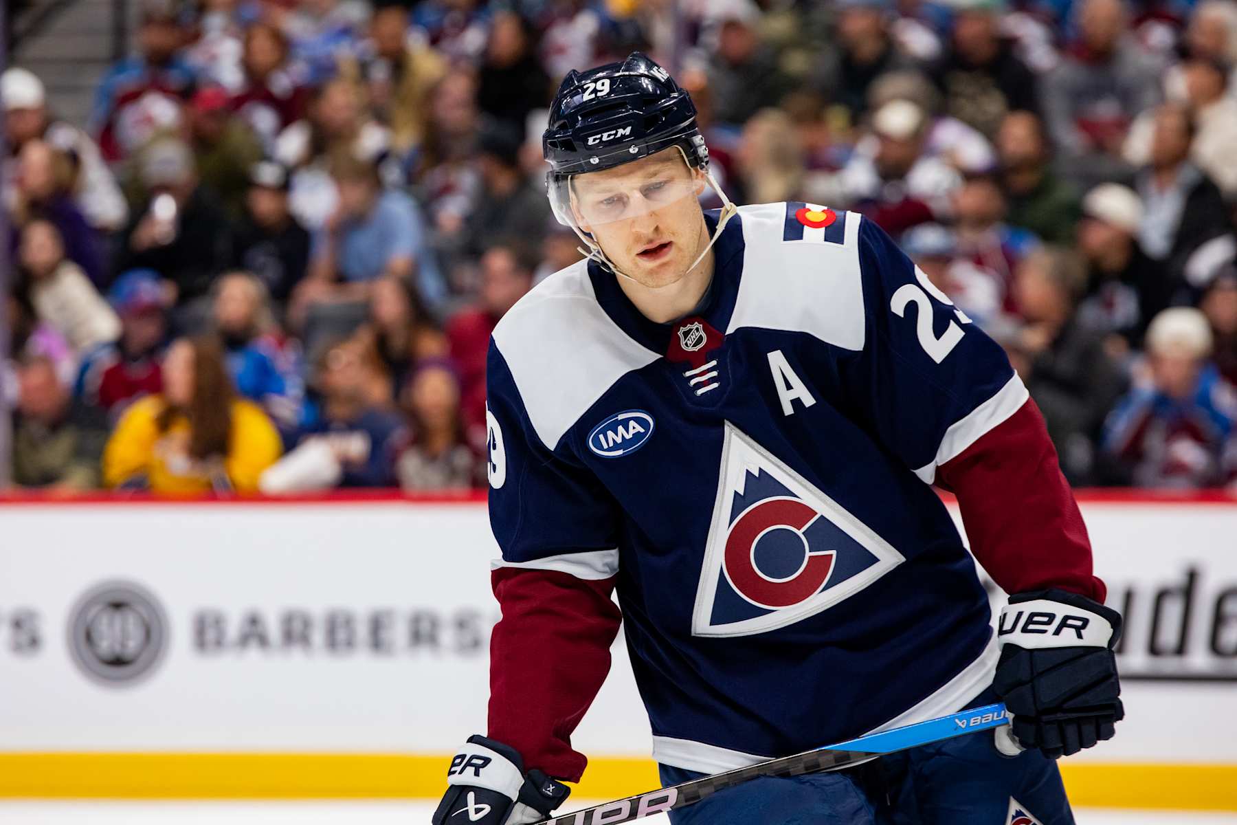 DENVER, COLORADO - NOVEMBER 11: Nathan MacKinnon #29 of the Colorado Avalanche looks down during a pause in the game Nashville Predators at Ball Arena on November 11, 2024 in Denver, Colorado. (Photo by Ashley Potts/NHLI via Getty Images)