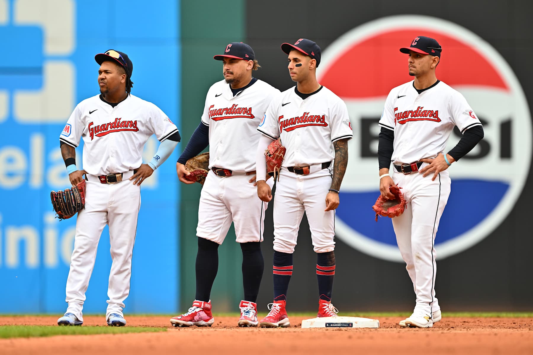 CLEVELAND, OHIO - OCTOBER 12: (L-R) José Ramírez #11, Josh Naylor #22, Brayan Rocchio #4 and Andrés Giménez #0 of the Cleveland Guardians look on during a pitching change during the fifth inning against the Detroit Tigers during Game Five of the Division Series at Progressive Field on October 12, 2024 in Cleveland, Ohio. (Photo by Jason Miller/Getty Images)