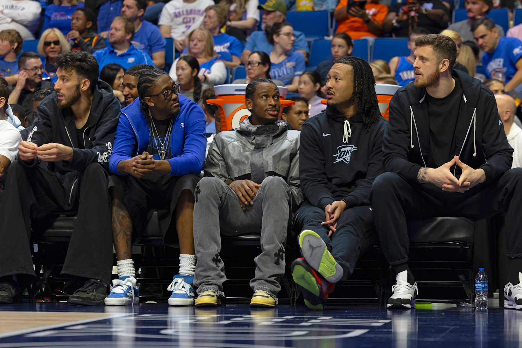 TULSA, OK - OCTOBER 10: Chet Holmgren #7, Luguentz Dort #5, Shai Gilgeous-Alexander #2, Jaylin Williams #6, and Isaiah Hartenstein #55 of the Oklahoma City Thunder sit on the bench during the game against the New Zealand Breakers during a NBA preseason game on October 10, 2024 at BOK Center in Tulsa, Oklahoma. NOTE TO USER: User expressly acknowledges and agrees that, by downloading and or using this photograph, User is consenting to the terms and conditions of the Getty Images License Agreement. Mandatory Copyright Notice: Copyright 2024 NBAE (Photo by Zach Beeker/NBAE via Getty Images)