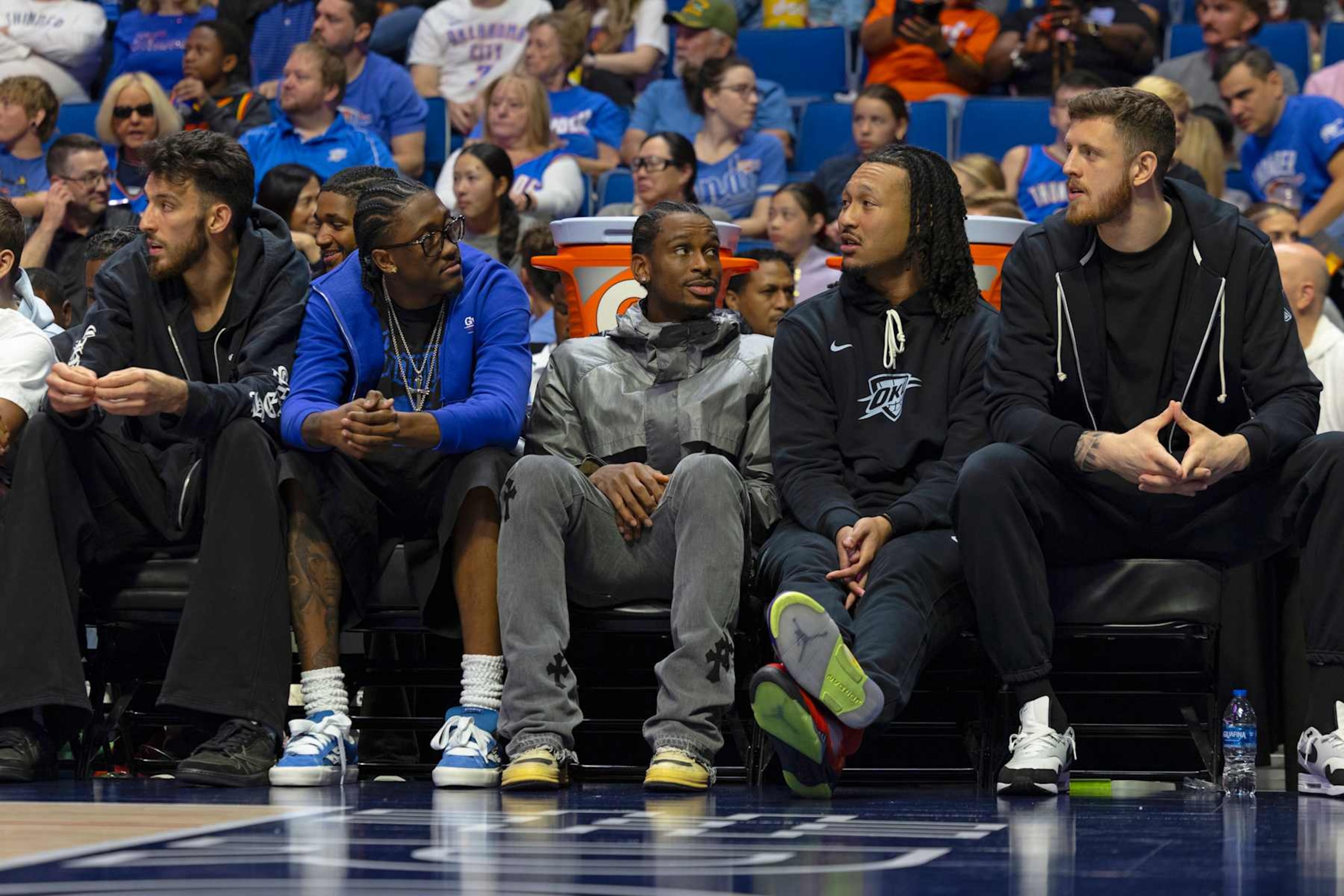 TULSA, OK - OCTOBER 10: Chet Holmgren #7, Luguentz Dort #5, Shai Gilgeous-Alexander #2, Jaylin Williams #6, and Isaiah Hartenstein #55 of the Oklahoma City Thunder sit on the bench during the game against the New Zealand Breakers during a NBA preseason game on October 10, 2024 at BOK Center in Tulsa, Oklahoma. NOTE TO USER: User expressly acknowledges and agrees that, by downloading and or using this photograph, User is consenting to the terms and conditions of the Getty Images License Agreement. Mandatory Copyright Notice: Copyright 2024 NBAE (Photo by Zach Beeker/NBAE via Getty Images)