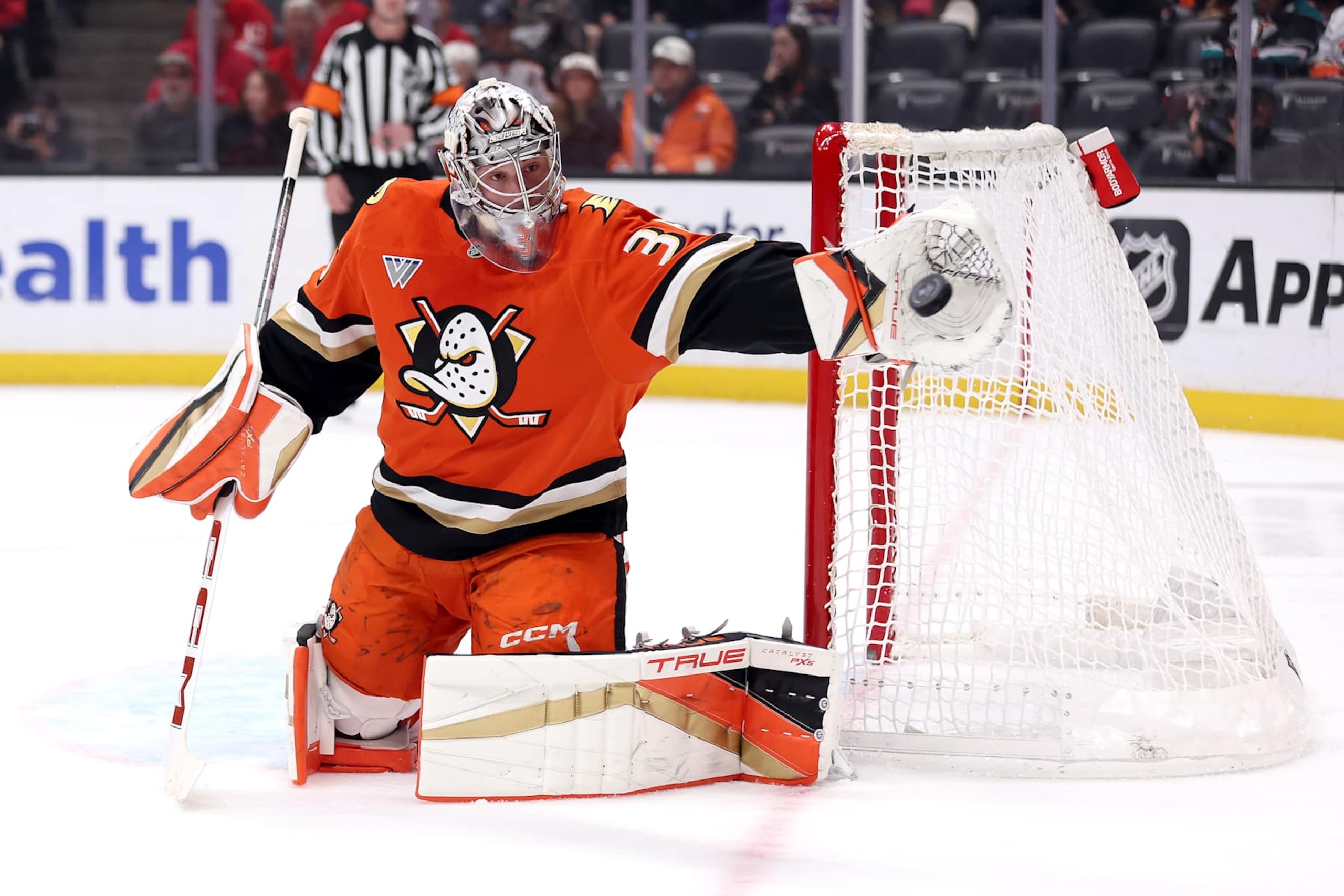 ANAHEIM, CALIFORNIA - NOVEMBER 15: John Gibson #36 of the Anaheim Ducks makes a glove save during the first period of a game against the Detroit Red Wings  at Honda Center on November 15, 2024 in Anaheim, California. (Photo by Sean M. Haffey/Getty Images)