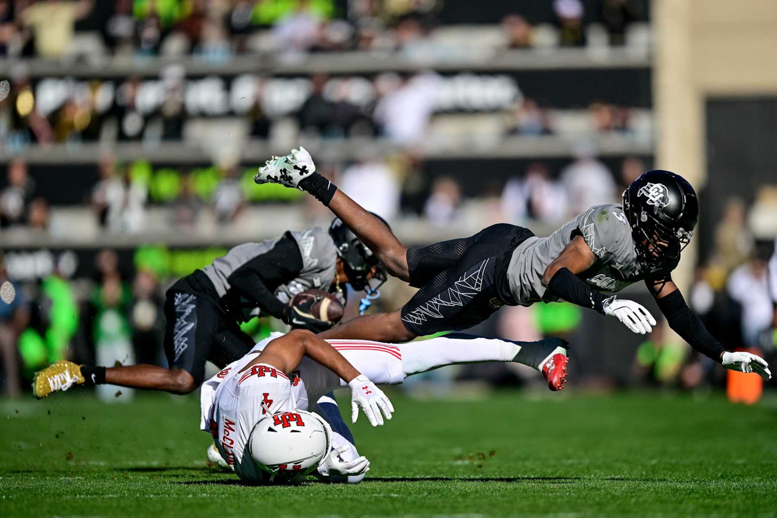 BOULDER, CO - NOVEMBER 16: Colton Hood #3 of the Colorado Buffaloes breaks up a pass intended for Munir McClain #4 of the Utah Utes as Travis Hunter #12 of the Colorado Buffaloes intercepts the loose ball on the play in the first quarter at Folsom Field on November 16, 2024 in Boulder, Colorado. (Photo by Dustin Bradford/Getty Images) BOULDER, CO - NOVEMBER 16: Colton Hood #3 of the Colorado Buffaloes breaks up a pass intended for Munir McClain #4 of the Utah Utes as Travis Hunter #12 of the Colorado Buffaloes intercepts the loose ball on the play in the first quarter at Folsom Field on November 16, 2024 in Boulder, Colorado. (Photo by Dustin Bradford/Getty Images)