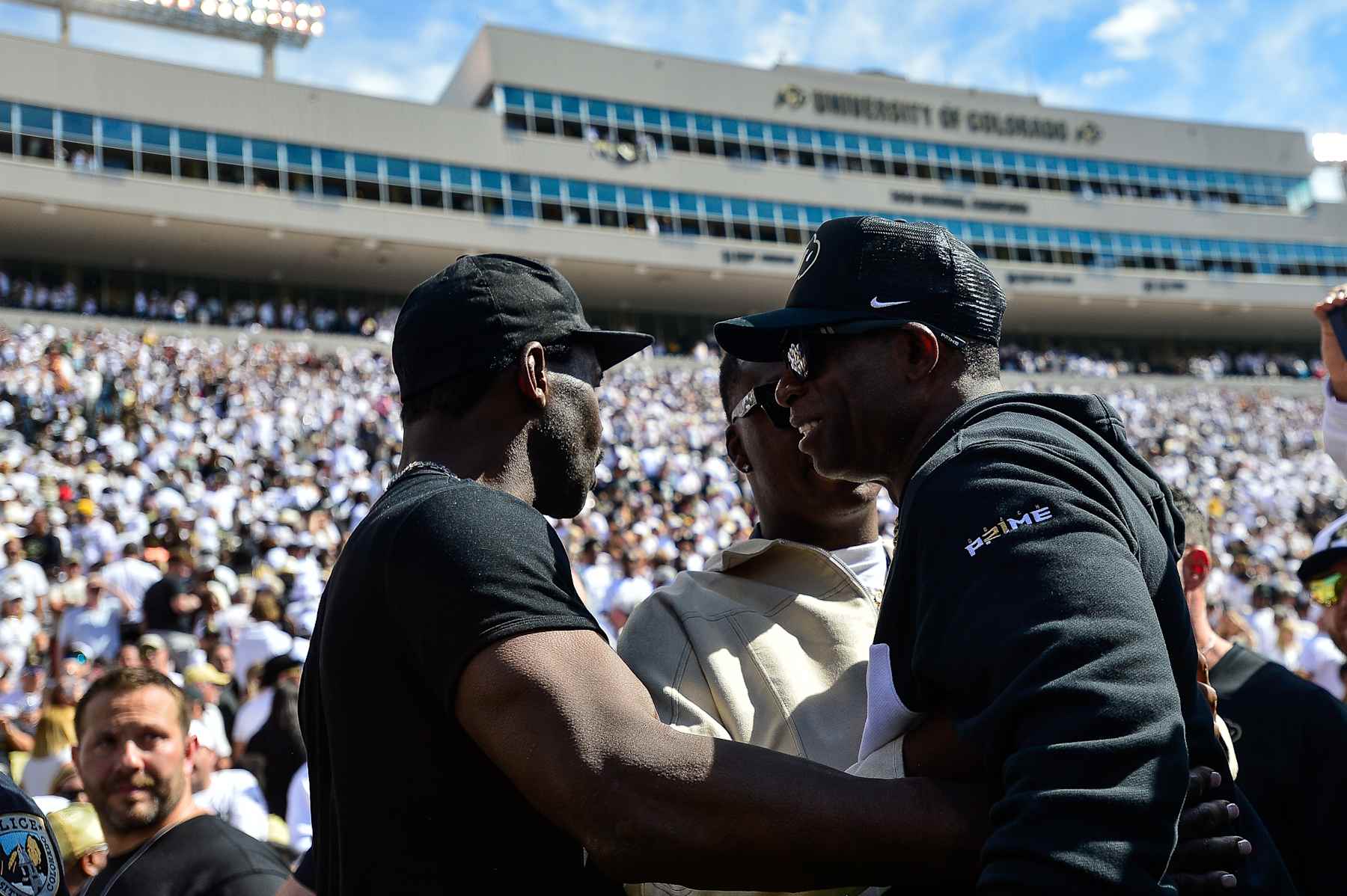 BOULDER, CO - SEPTEMBER 30:  Head coach Deion Sanders of the Colorado Buffaloes has a word with rapper known as Symba and former NFL player Michael Irvin after a game against the USC Trojans at Folsom Field on September 30, 2023 in Boulder, Colorado. (Photo by Dustin Bradford/Getty Images)