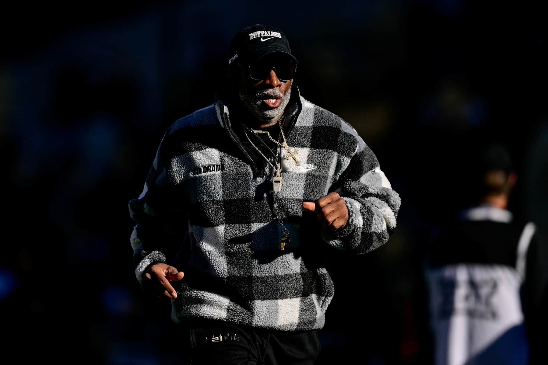 BOULDER, CO - NOVEMBER 16:  Head coach Deion Sanders of the Colorado Buffaloes runs on the field before a game against the Utah Utes at Folsom Field on November 16, 2024 in Boulder, Colorado. (Photo by Dustin Bradford/Getty Images)