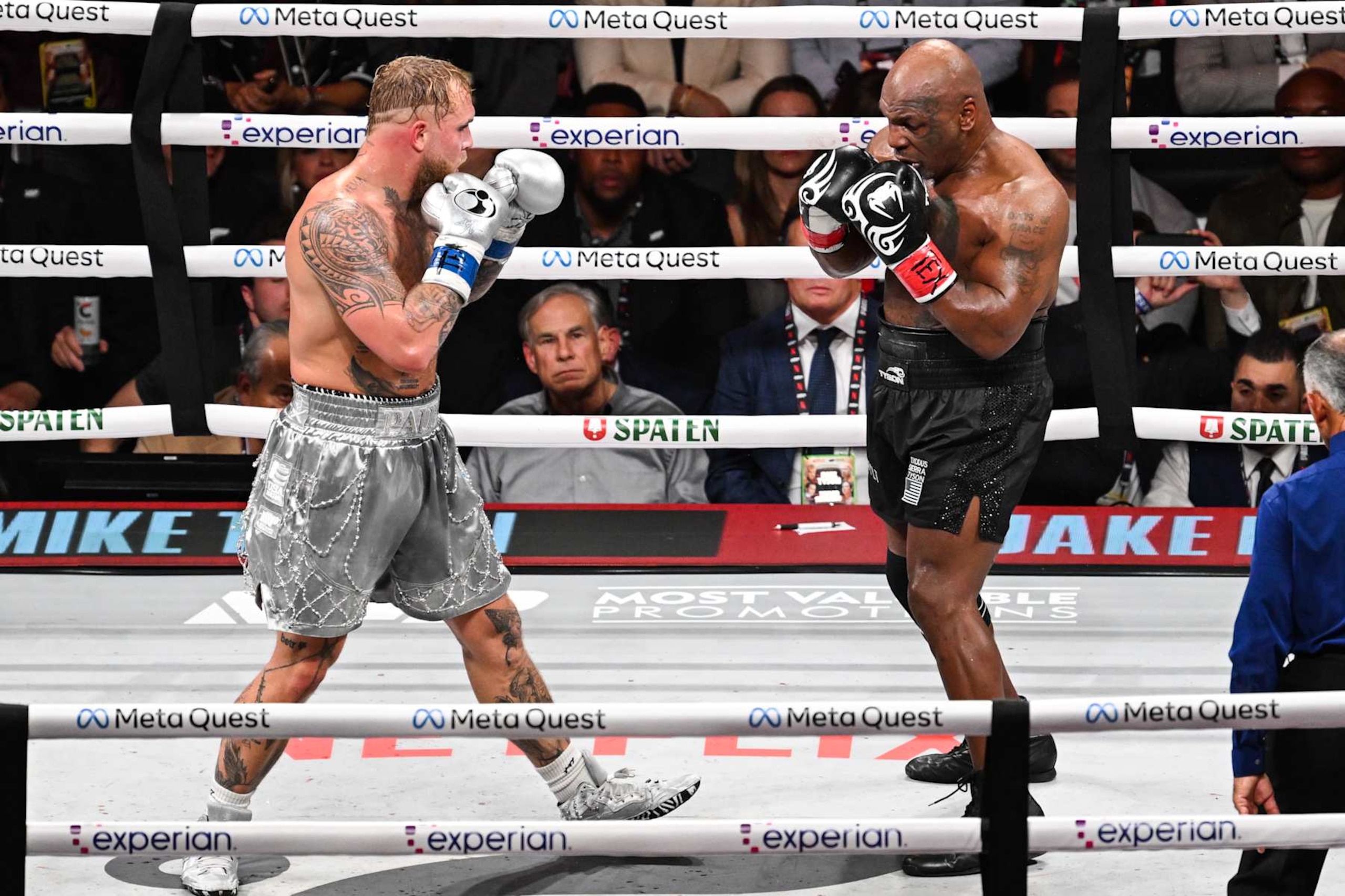 ARLINGTON, TEXAS - NOVEMBER 15: Mike Tyson (in black short) and Jake Paul (in silver short) exchange punches during their heavyweight world titles of the Premiere Boxing Championship on Friday night at AT&T Stadium in Arlington, Texas, United States on November 15, 2024. (Photo by Tayfun Coskun/Anadolu via Getty Images) ARLINGTON, TEXAS - NOVEMBER 15: Mike Tyson (in black short) and Jake Paul (in silver short) exchange punches during their heavyweight world titles of the Premiere Boxing Championship on Friday night at AT&T Stadium in Arlington, Texas, United States on November 15, 2024. (Photo by Tayfun Coskun/Anadolu via Getty Images)