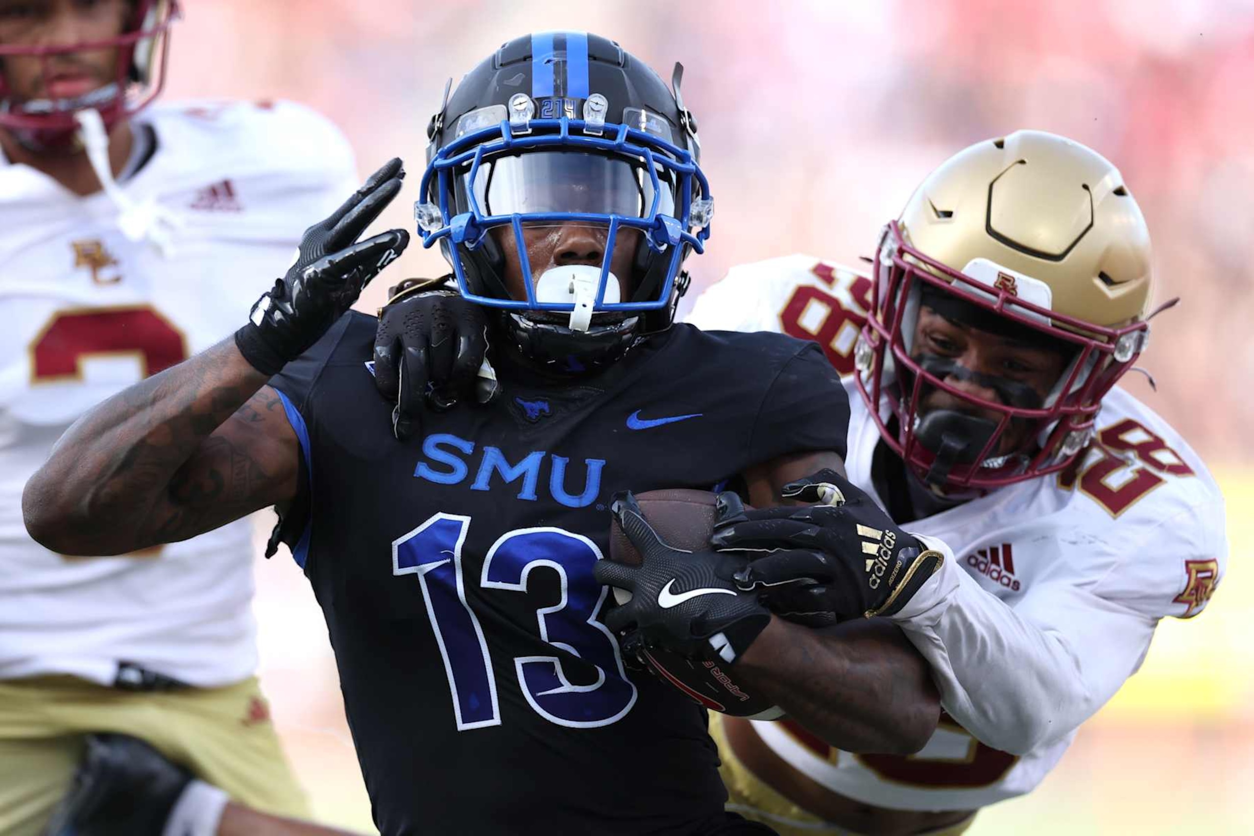 DALLAS, TEXAS - NOVEMBER 16: Roderick Daniels Jr. #13 of the Southern Methodist Mustangs is tackled by Carter Davis #28 of the Boston College Eagles during the first half at Gerald J. Ford Stadium on November 16, 2024 in Dallas, Texas. (Photo by Sam Hodde/Getty Images) DALLAS, TEXAS - NOVEMBER 16: Roderick Daniels Jr. #13 of the Southern Methodist Mustangs is tackled by Carter Davis #28 of the Boston College Eagles during the first half at Gerald J. Ford Stadium on November 16, 2024 in Dallas, Texas. (Photo by Sam Hodde/Getty Images)
