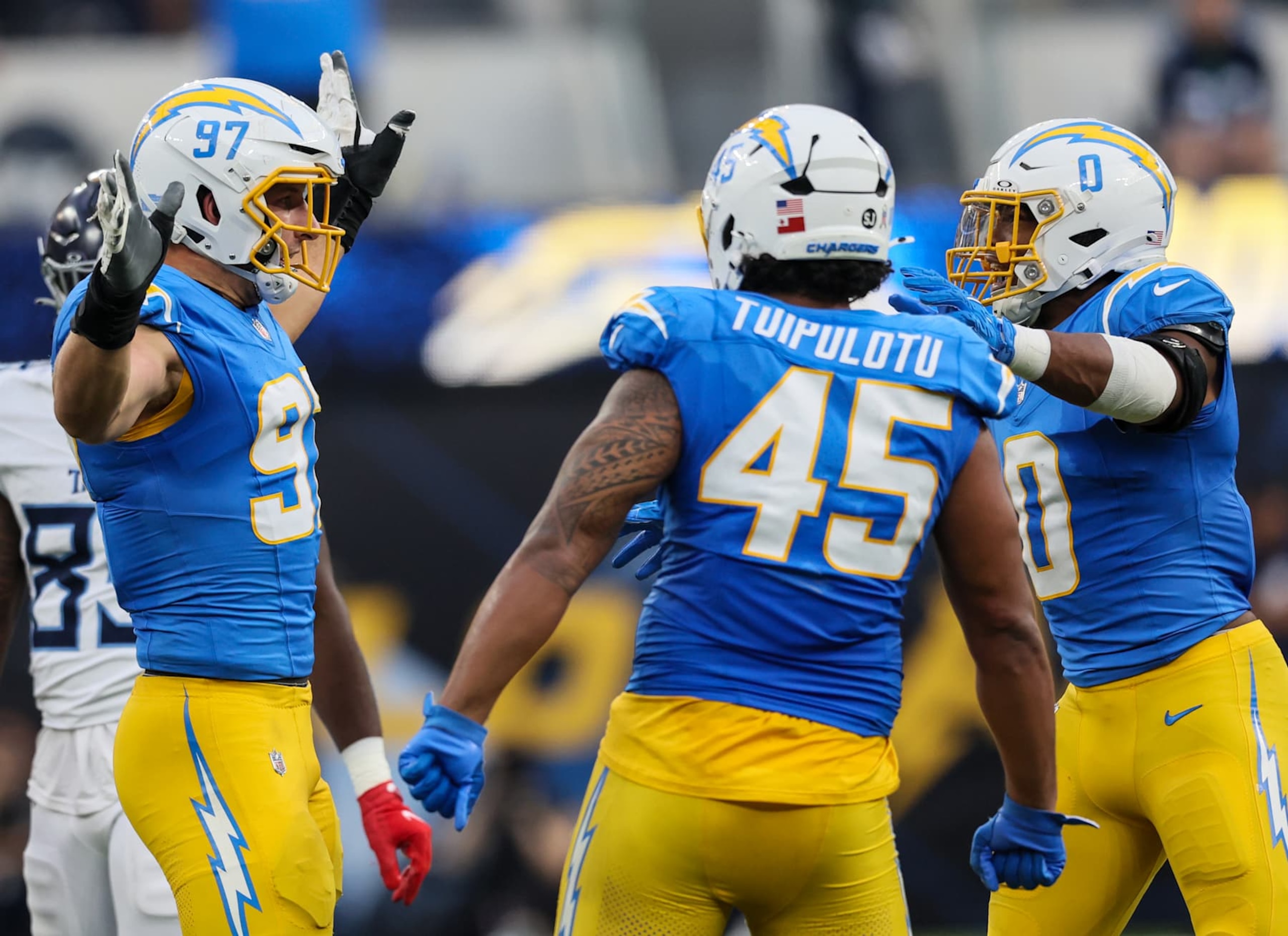 Inglewood, CA, Sunday, November 10, 2024 - Los Angeles Chargers linebacker Joey Bosa (97) celebrates with teammates after sacking Tennessee Titans quarterback Will Levis (8) at  SoFi Stadium. (Robert Gauthier/Los Angeles Times via Getty Images)