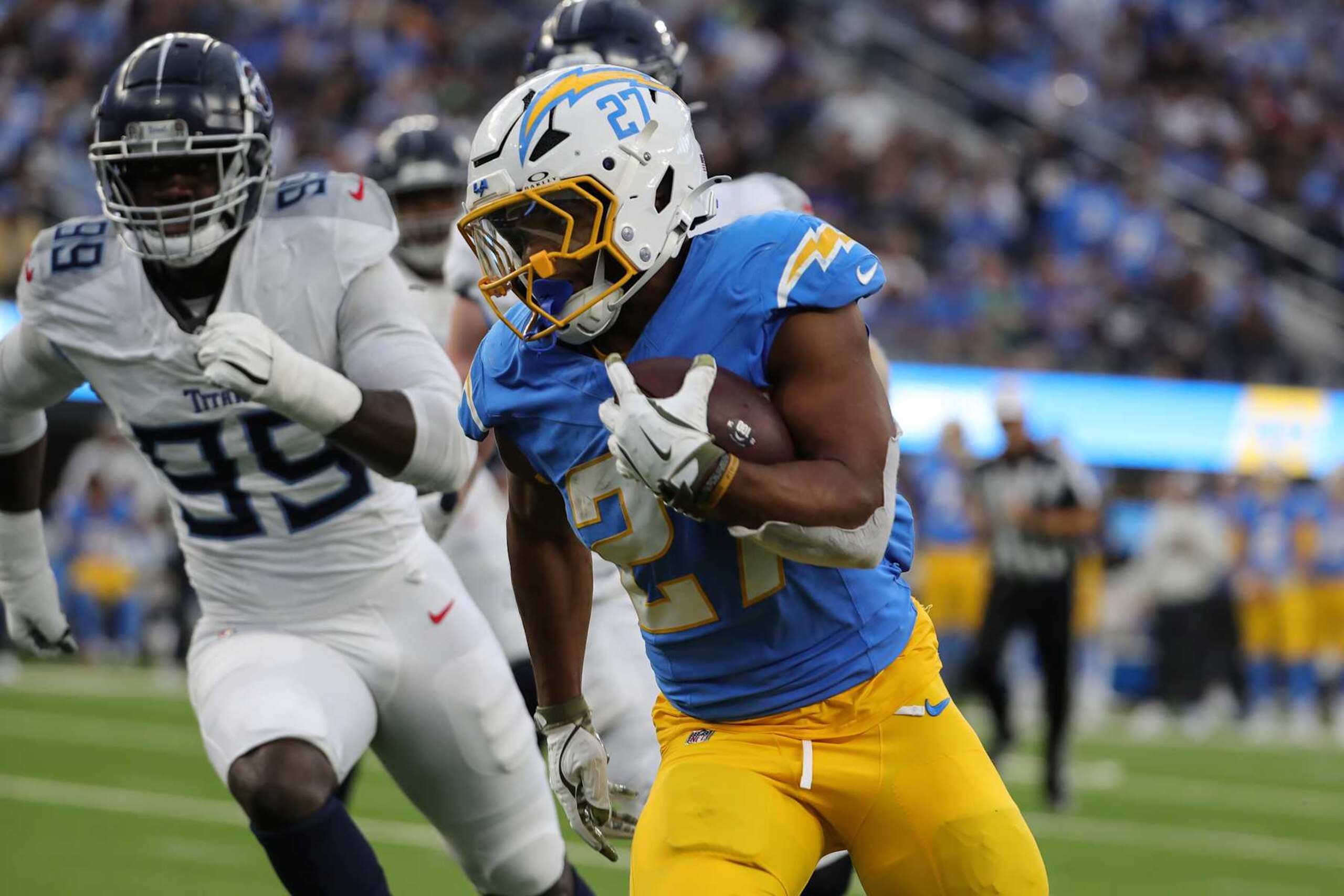 INGLEWOOD, CA - NOVEMBER 10: Los Angeles Chargers running back J.K. Dobbins (27) runs during the Tennessee Titans game versus the Los Angeles Chargers on November 10, 2024, at Sofi Stadium in Inglewood, CA. (Photo by Jevone Moore/Icon Sportswire via Getty Images)