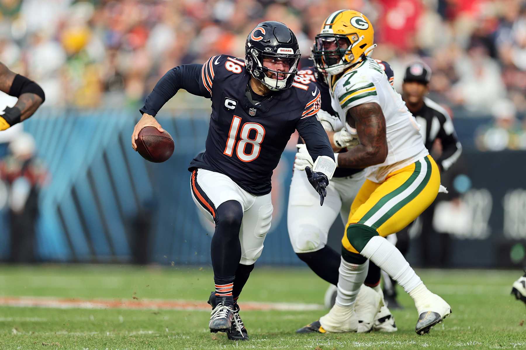 CHICAGO, ILLINOIS - NOVEMBER 17: Caleb Williams #18 of the Chicago Bears scrambles during the second quarter against the Green Bay Packers at Soldier Field on November 17, 2024 in Chicago, Illinois. (Photo by Michael Reaves/Getty Images)