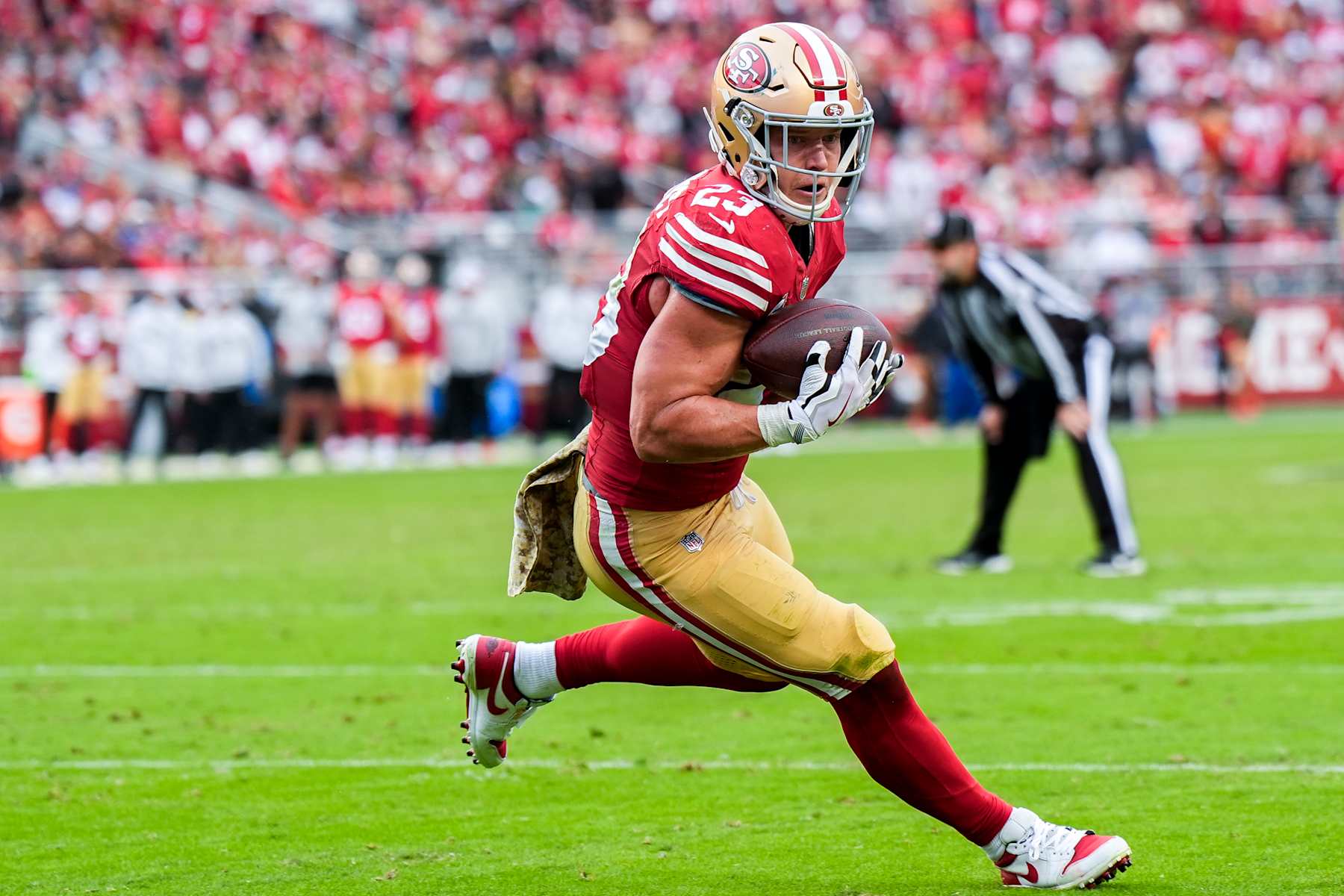 SANTA CLARA, CALIFORNIA - NOVEMBER 17: Christian McCaffrey #23 of the San Francisco 49ers runs the ball up the field in the fourth quarter of a game against the Seattle Seahawks at Levi's Stadium on November 17, 2024 in Santa Clara, California. (Photo by Thearon W. Henderson/Getty Images)