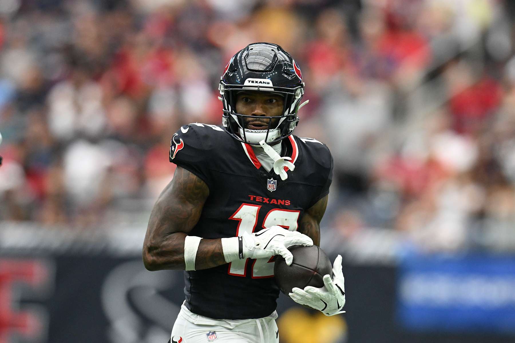 HOUSTON, TEXAS - SEPTEMBER 29: Nico Collins #12 of the Houston Texans runs after catching a pass during the second quarter of the game against the Jacksonville Jaguars at NRG Stadium on September 29, 2024 in Houston, Texas. (Photo by Jack Gorman/Getty Images)