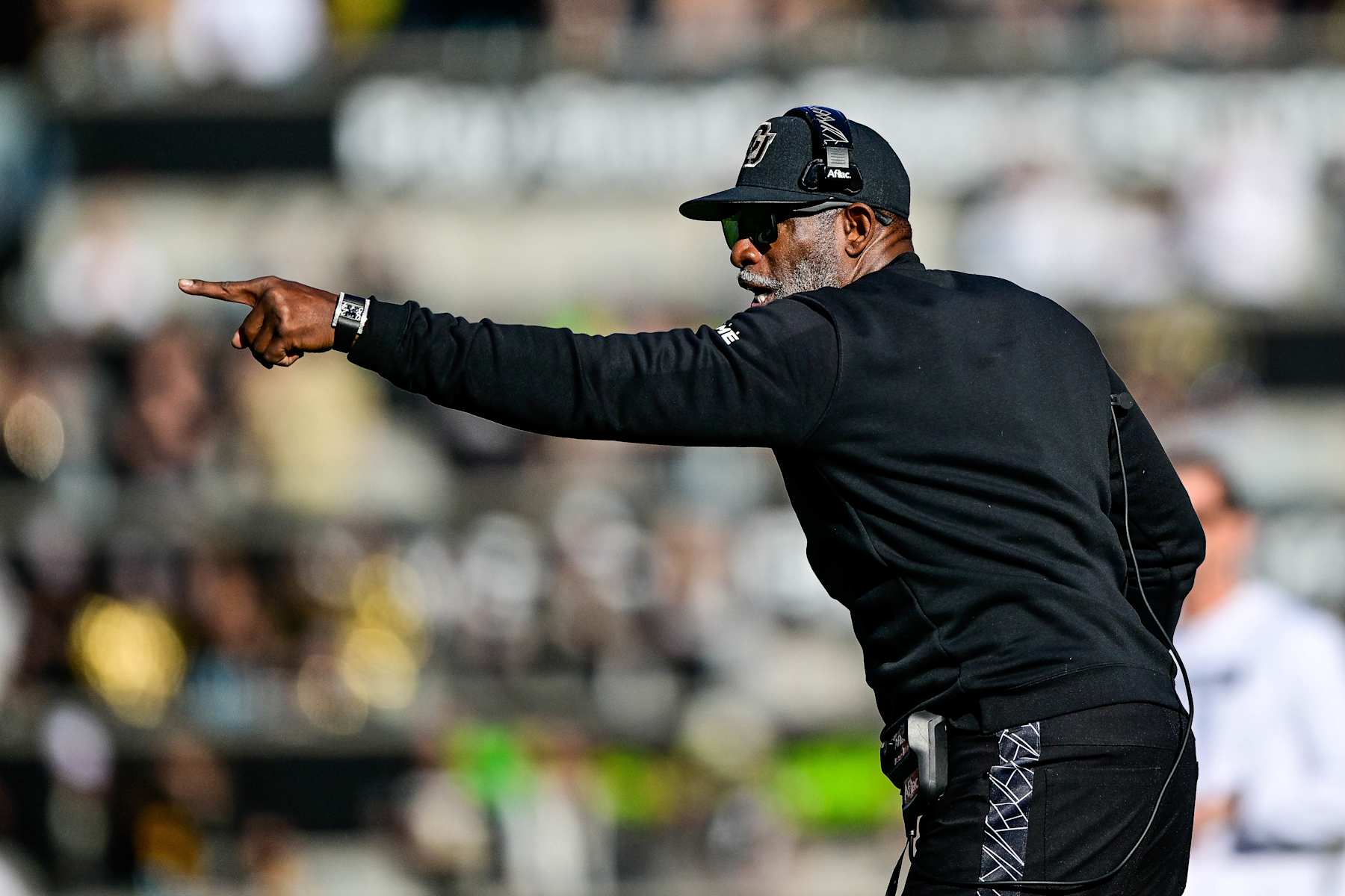 BOULDER, CO - NOVEMBER 16:  Head coach Deion Sanders of the Colorado Buffaloes directs his team in the first half of a game against the Utah Utes at Folsom Field on November 16, 2024 in Boulder, Colorado. (Photo by Dustin Bradford/Getty Images)