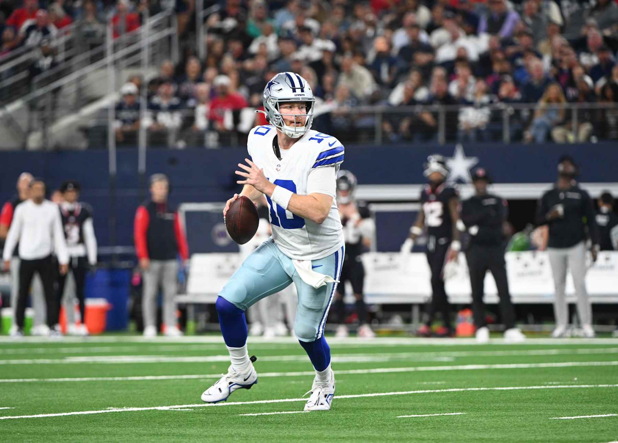ARLINGTON, TX - NOVEMBER 18: Dallas Cowboys QB Cooper Rush scrambles in the pocket during game featuring the Houston Texans and the Dallas Cowboys on November 18, 2024 at AT&T Stadium in Arlington, TX. (Photo by John Rivera/Icon Sportswire via Getty Images)