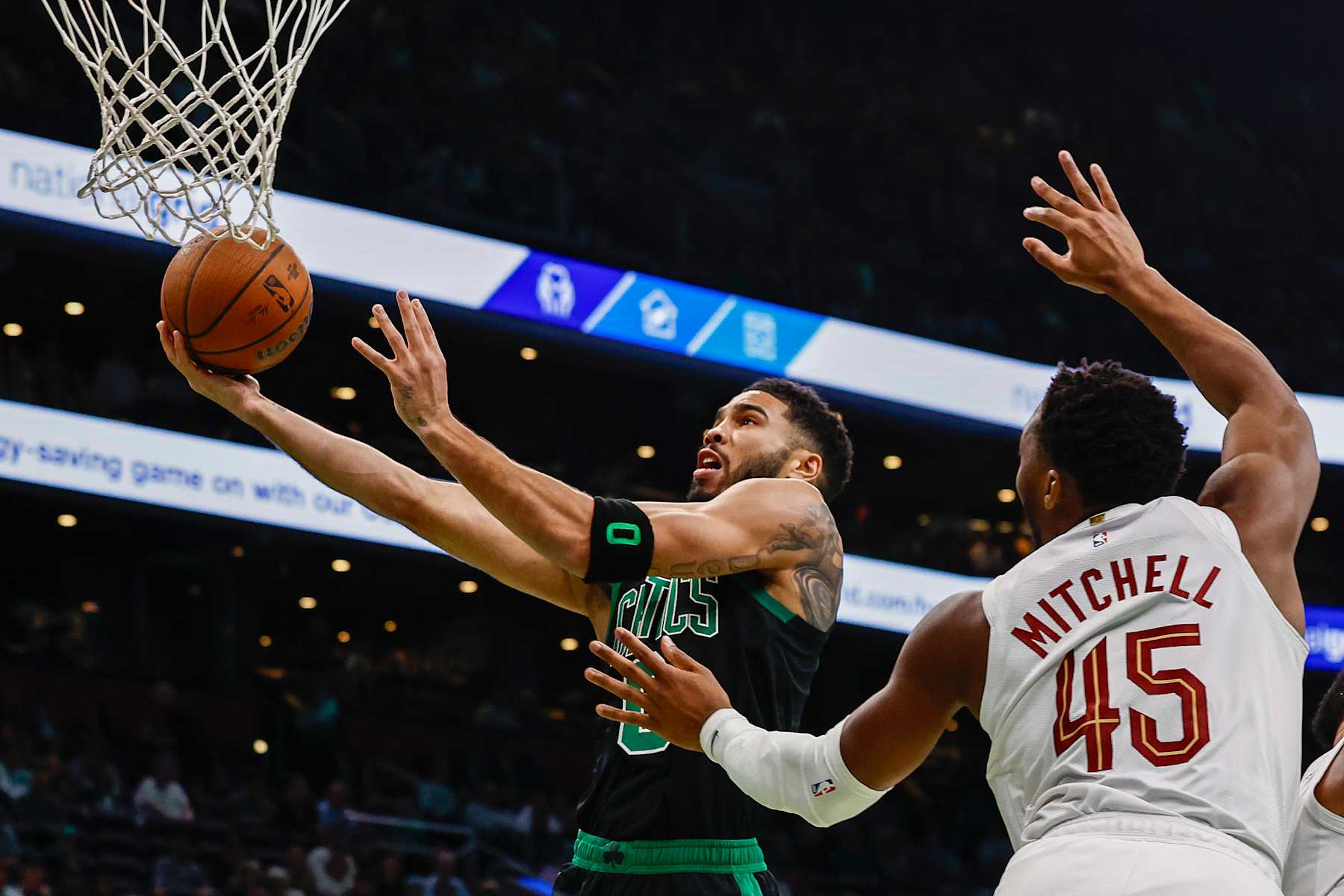 BOSTON, MASSACHUSETTS - NOVEMBER 19: Jayson Tatum #0 of the Boston Celtics shoots against Donovan Mitchell #45 of the Cleveland Cavaliers during the first quarter of the Emirates NBA Cup at TD Garden on November 19, 2024 in Boston, Massachusetts. NOTE TO USER: User expressly acknowledges and agrees that, by downloading and or using this photograph, User is consenting to the terms and conditions of the Getty Images License Agreement.  (Photo by Winslow Townson/Getty Images)