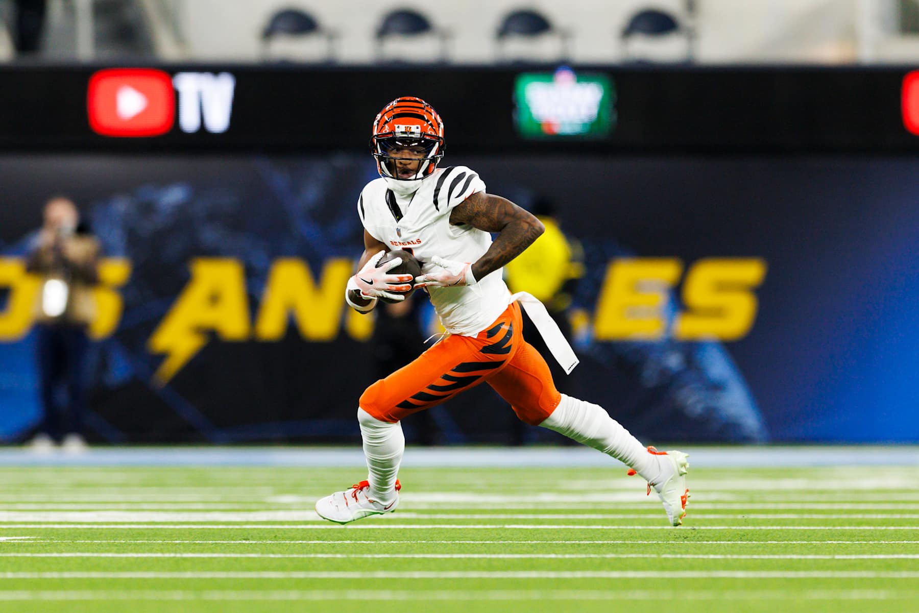 INGLEWOOD, CALIFORNIA - NOVEMBER 17: Ja'Marr Chase #1 of the Cincinnati Bengals runs after the catch during the first half against the Los Angeles Chargers at SoFi Stadium on November 17, 2024 in Inglewood, California. (Photo by Ric Tapia/Getty Images)