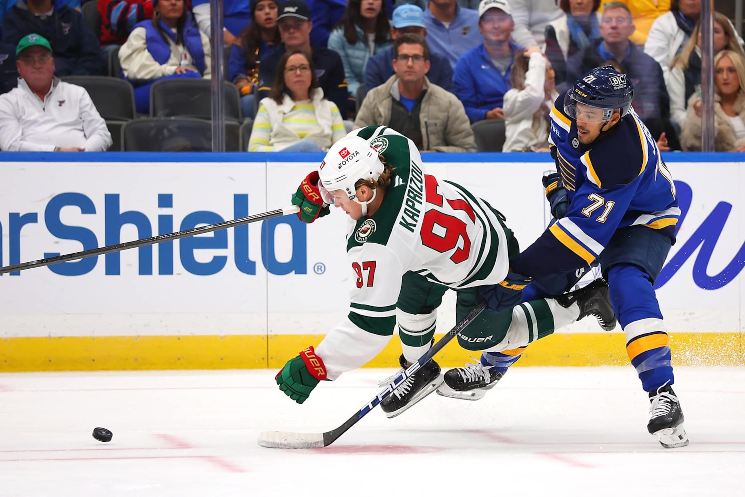 ST LOUIS, MISSOURI - OCTOBER 15: Mathieu Joseph #71 of the St. Louis Blues fights Kirill Kaprizov #97 of the Minnesota Wild for control of the puck in the second period at Enterprise Center on October 15, 2024 in St Louis, Missouri. (Photo by Dilip Vishwanat/Getty Images) ST LOUIS, MISSOURI - OCTOBER 15: Mathieu Joseph #71 of the St. Louis Blues fights Kirill Kaprizov #97 of the Minnesota Wild for control of the puck in the second period at Enterprise Center on October 15, 2024 in St Louis, Missouri. (Photo by Dilip Vishwanat/Getty Images)