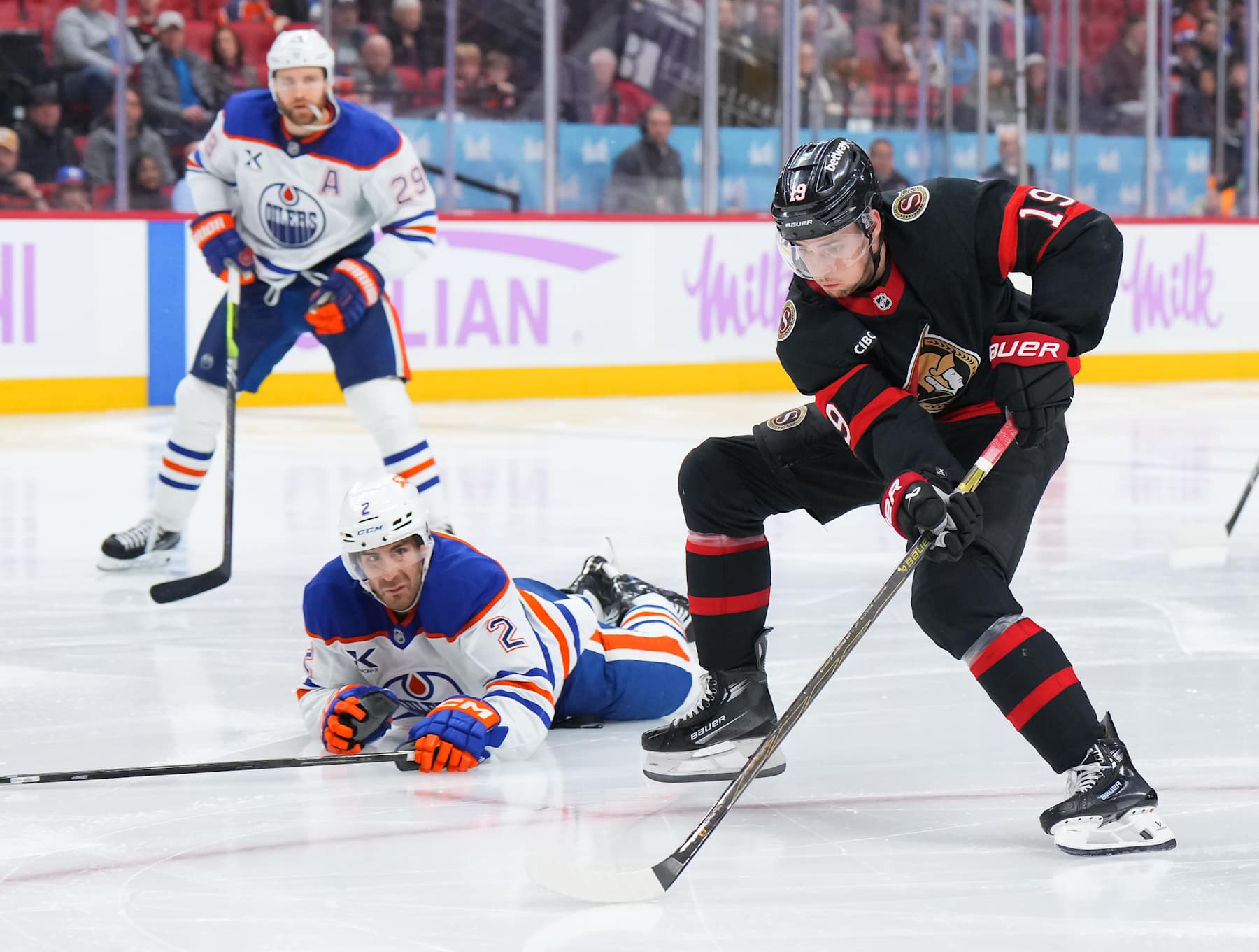 OTTAWA, ON - NOVEMBER 19: Drake Batherson #19 of the Ottawa Senators controls the puck against Evan Bouchard #2 of the Edmonton Oilers during the third period at Canadian Tire Centre on November 19, 2024 in Ottawa, Ontario, Canada. (Photo by André Ringuette/NHLI via Getty Images)