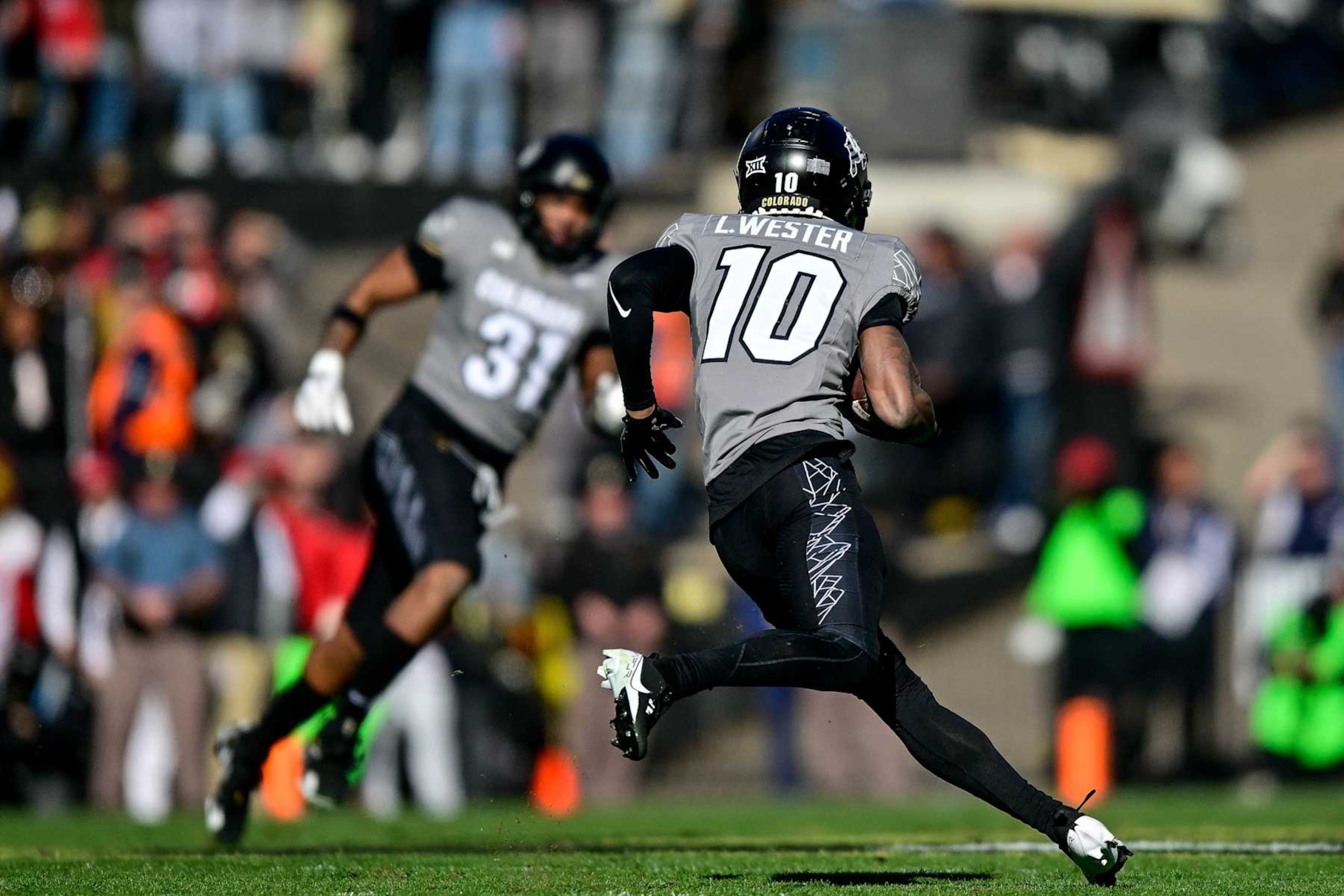 BOULDER, CO - NOVEMBER 16:  LaJohntay Wester #10 of the Colorado Buffaloes returns a punt before scoring a touchdown on the play in the first quarter against the Utah Utes at Folsom Field on November 16, 2024 in Boulder, Colorado. (Photo by Dustin Bradford/Getty Images)