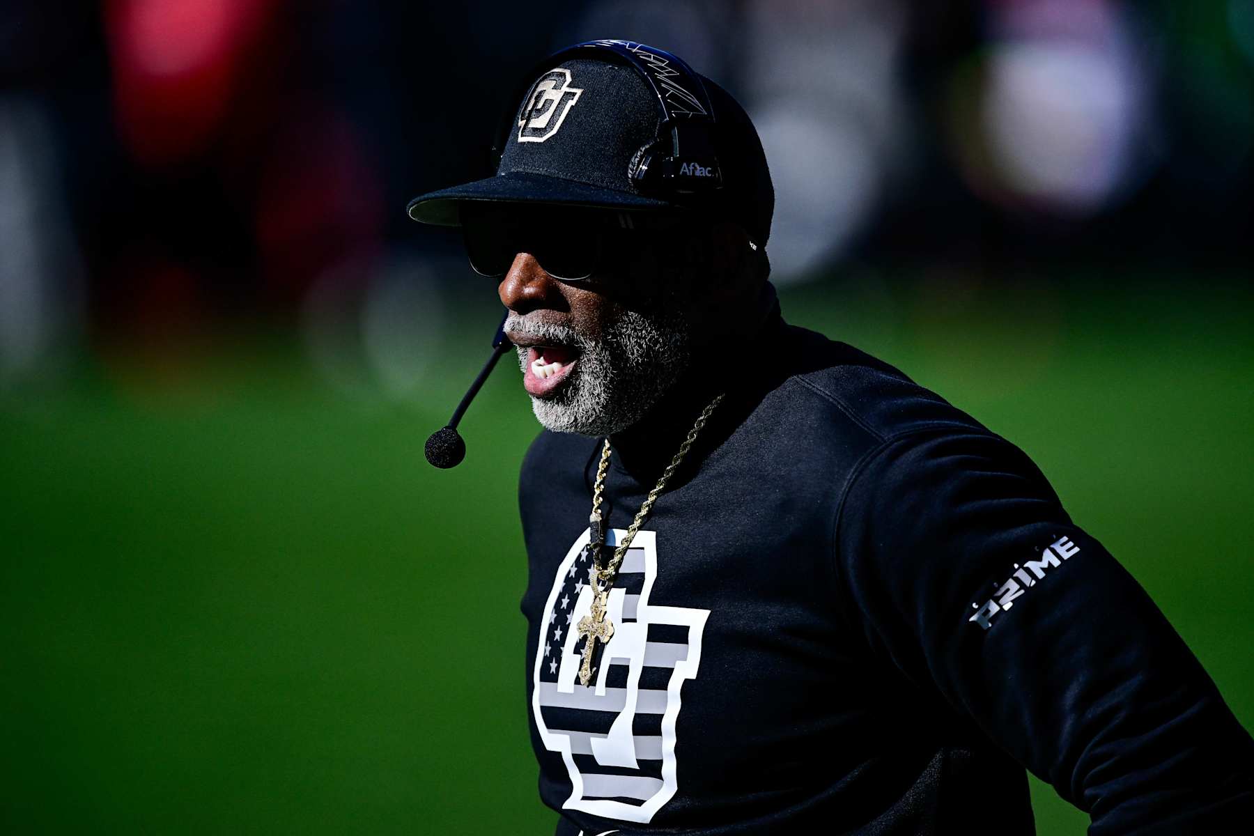 BOULDER, CO - NOVEMBER 16:  Head coach Deion Sanders of the Colorado Buffaloes walks along the sideline in a game against the Utah Utes at Folsom Field on November 16, 2024 in Boulder, Colorado. (Photo by Dustin Bradford/Getty Images)