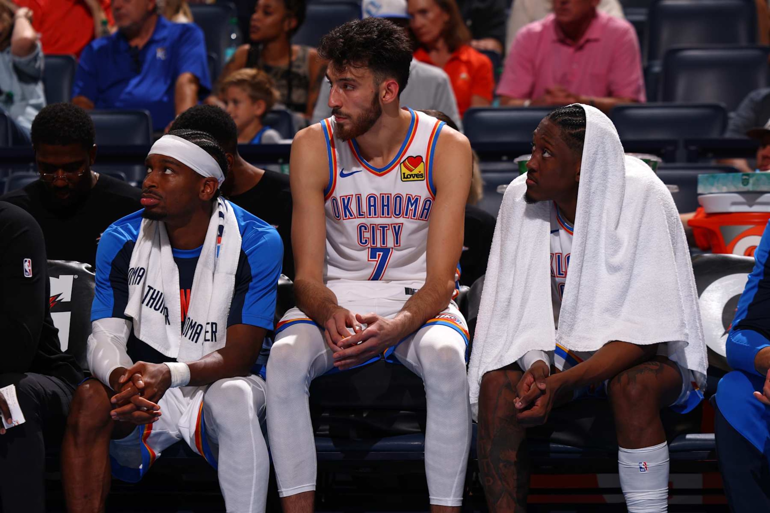 OKLAHOMA CITY, OK - OCTOBER 9: Shai Gilgeous-Alexander #2, Chet Holmgren #7, and Jalen Williams #8 of the Oklahoma City Thunder look on during the game against the Houston Rockets during a NBA pre season game on October 9, 2024 at Paycom Center in Oklahoma City, Oklahoma. NOTE TO USER: User expressly acknowledges and agrees that, by downloading and or using this photograph, User is consenting to the terms and conditions of the Getty Images License Agreement. Mandatory Copyright Notice: Copyright 2024 NBAE (Photo by Zach Beeker/NBAE via Getty Images) OKLAHOMA CITY, OK - OCTOBER 9: Shai Gilgeous-Alexander #2, Chet Holmgren #7, and Jalen Williams #8 of the Oklahoma City Thunder look on during the game against the Houston Rockets during a NBA pre season game on October 9, 2024 at Paycom Center in Oklahoma City, Oklahoma. NOTE TO USER: User expressly acknowledges and agrees that, by downloading and or using this photograph, User is consenting to the terms and conditions of the Getty Images License Agreement. Mandatory Copyright Notice: Copyright 2024 NBAE (Photo by Zach Beeker/NBAE via Getty Images)