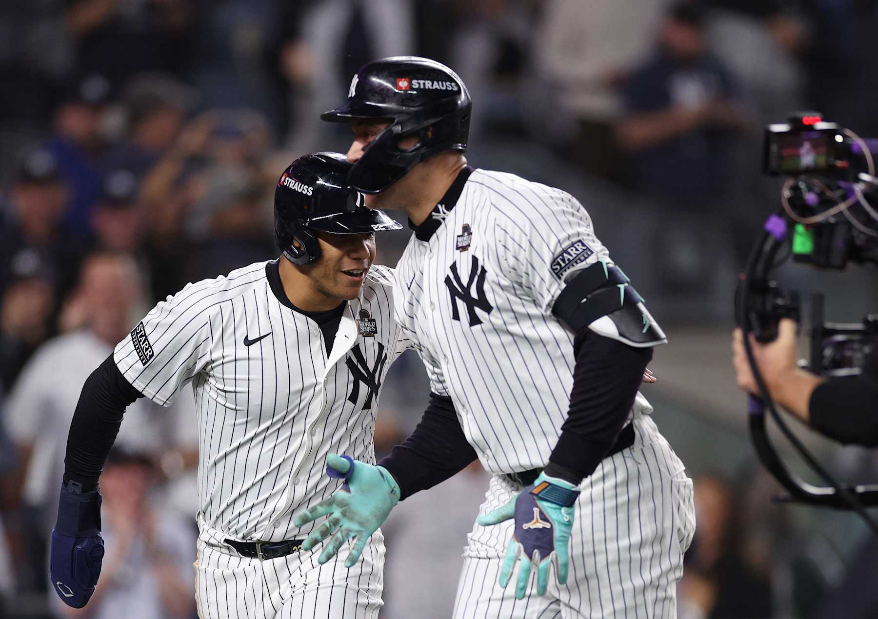 NEW YORK, NEW YORK - OCTOBER 30: Aaron Judge #99 of the New York Yankees is congratulated by Juan Soto #22 after hitting a two-run home run during the first inning of Game Five of the 2024 World Series against the Los Angeles Dodgers at Yankee Stadium on October 30, 2024 in the Bronx borough of New York City. (Photo by Elsa/Getty Images)