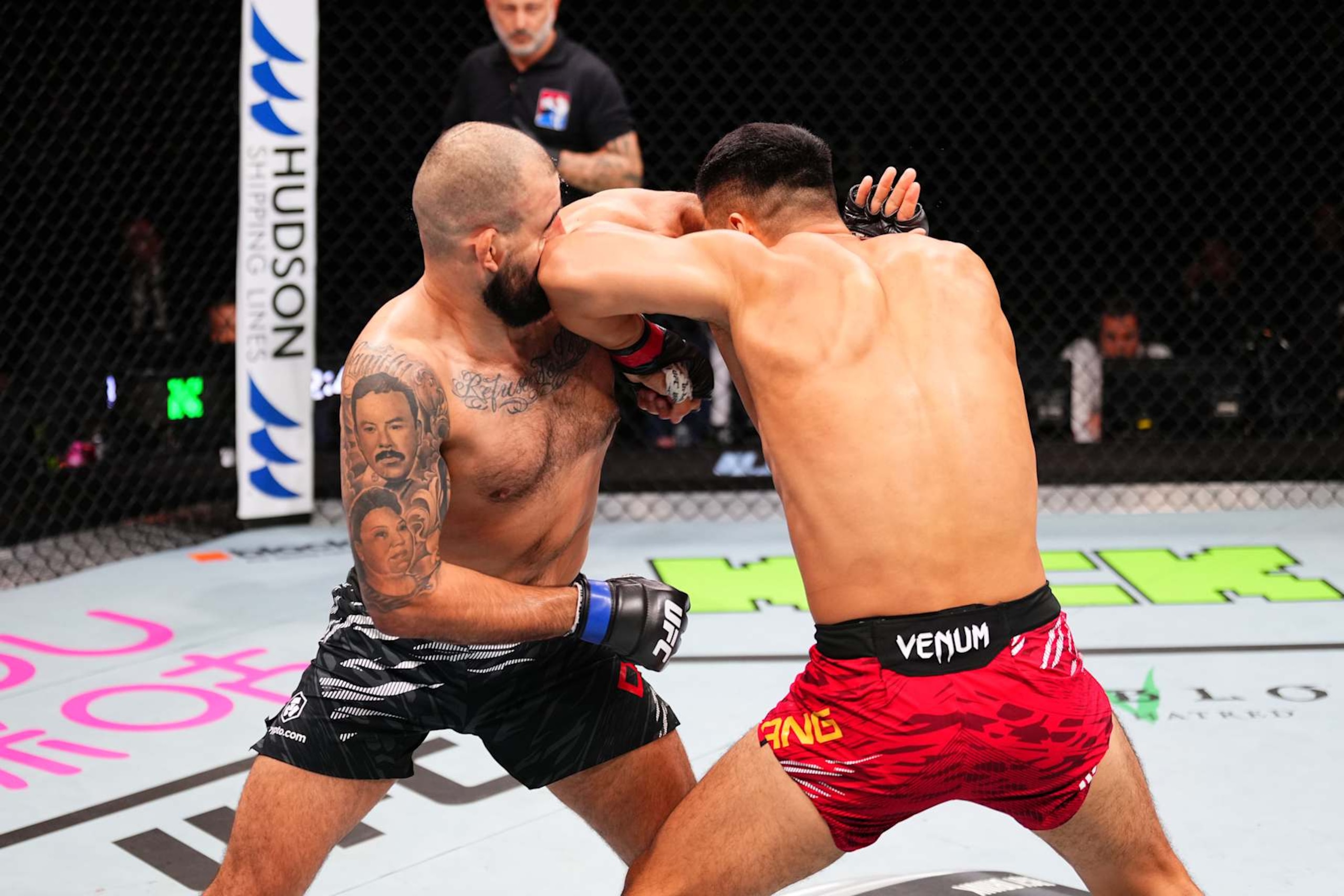 MACAU, CHINA - NOVEMBER 23:  (R-L) Zhang Mingyang of China elbows Ozzy Diaz in their light heavyweight fight during the UFC Fight Night event at Galaxy Arena on November 23, 2024 in Macau, China. (Photo by Jeff Bottari/Zuffa LLC)