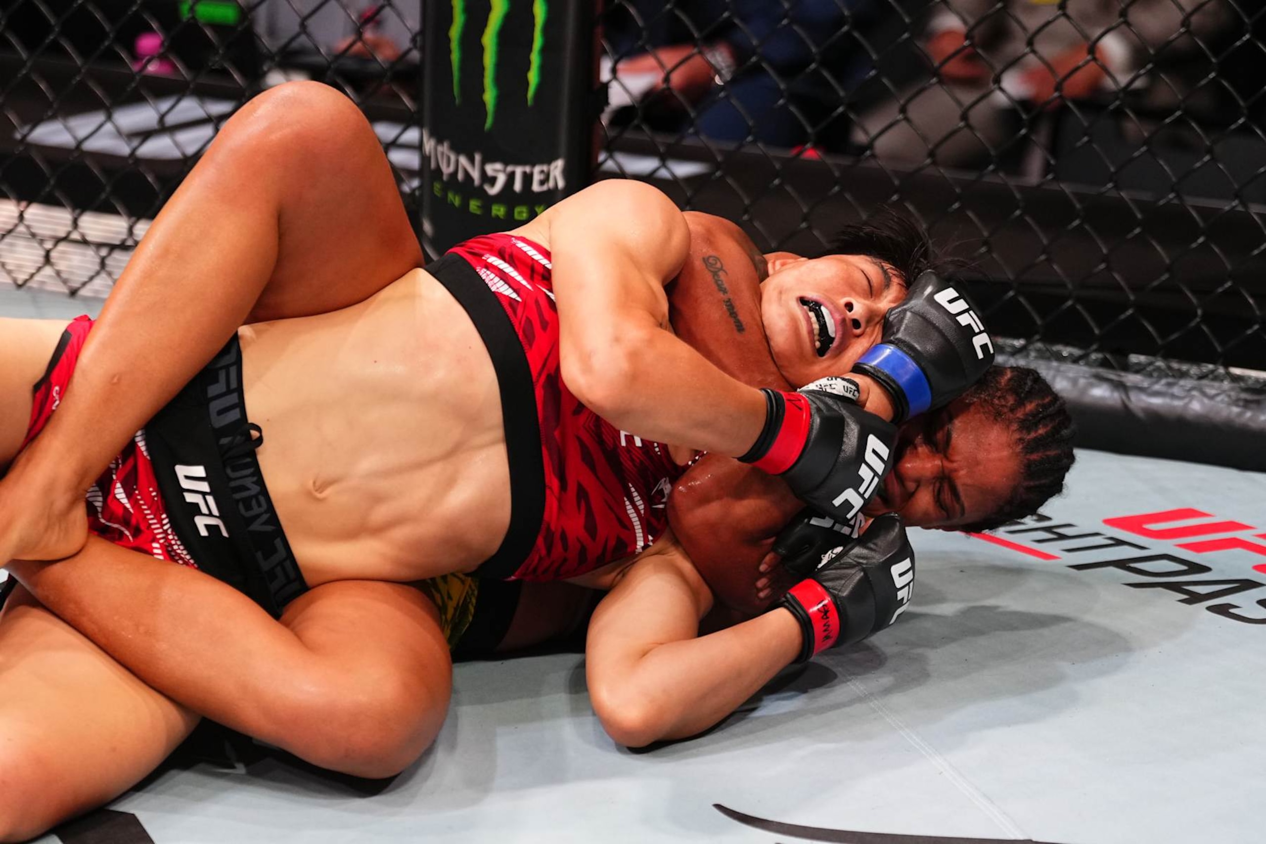 MACAU, CHINA - NOVEMBER 23:  (R-L) Gabriella Fernandes of Brazil submits Wang Cong of China in their women's flyweight fight during the UFC Fight Night event at Galaxy Arena on November 23, 2024 in Macau, China. (Photo by Jeff Bottari/Zuffa LLC)