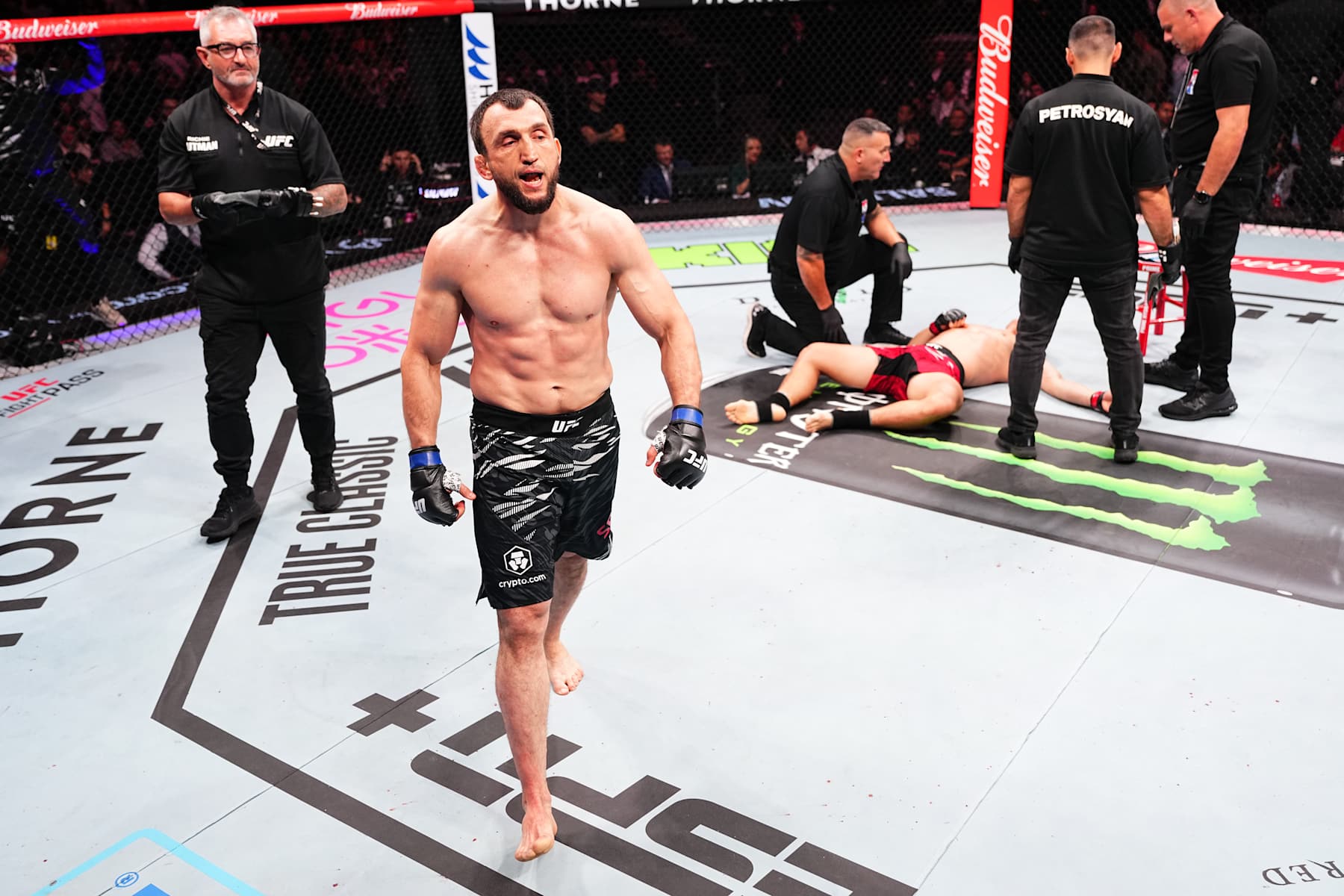 MACAU, CHINA - NOVEMBER 23: (L-R) Muslim Salikhov of Russia reacts after his KO victory over Song Kenan of China in their welterweight fight during the UFC Fight Night event at Galaxy Arena on November 23, 2024 in Macau, China. (Photo by Jeff Bottari/Zuffa LLC)