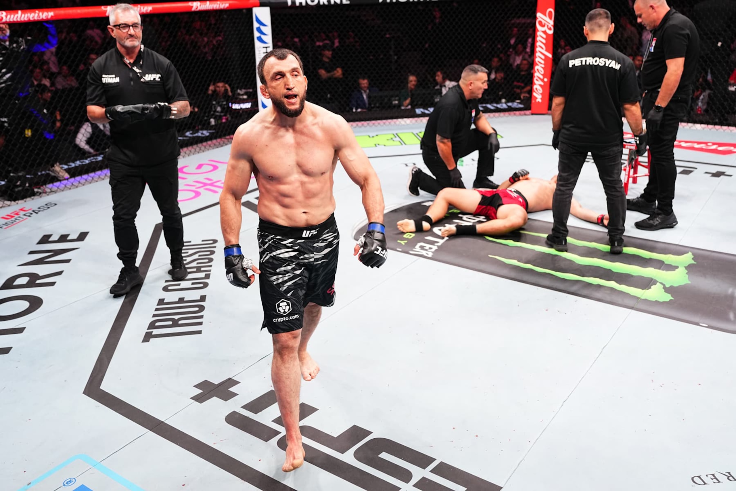 MACAU, CHINA - NOVEMBER 23:  (L-R) Muslim Salikhov of Russia reacts after his KO victory over Song Kenan of China in their welterweight fight during the UFC Fight Night event at Galaxy Arena on November 23, 2024 in Macau, China. (Photo by Jeff Bottari/Zuffa LLC)