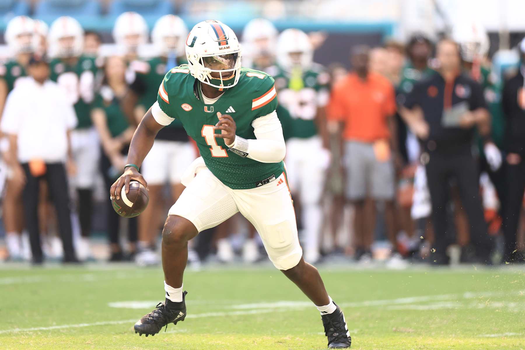 MIAMI GARDENS, FLORIDA - NOVEMBER 23: Cam Ward #1 of the Miami Hurricanes scrambles against the Wake Forest Demon Deacons during the first half at Hard Rock Stadium on November 23, 2024 in Miami Gardens, Florida.  (Photo by Carmen Mandato/Getty Images)