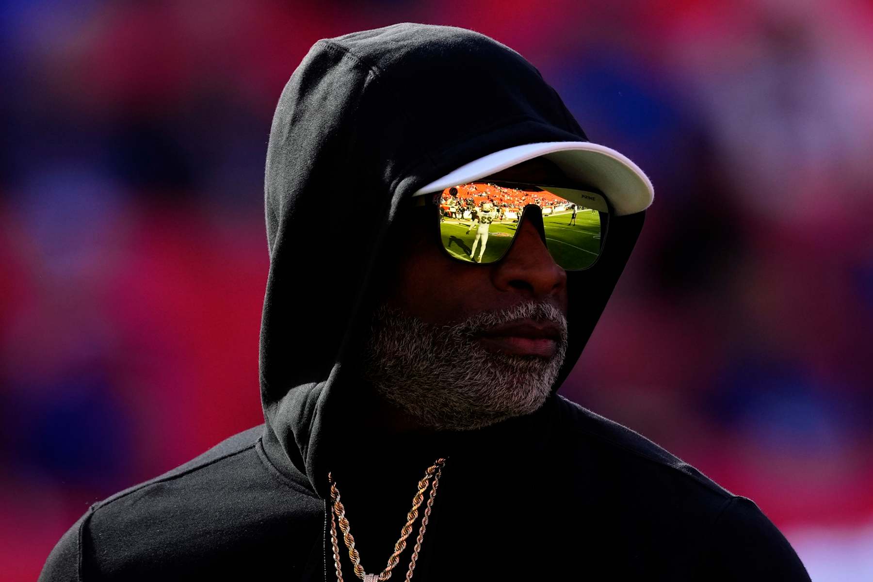 KANSAS CITY, MISSOURI - NOVEMBER 23: Head coach Deion Sanders of the Colorado Buffaloes watches his team warm up prior to a game against the Kansas Jayhawks at Arrowhead Stadium on November 23, 2024 in Kansas City, Missouri.  (Photo by Ed Zurga/Getty Images)