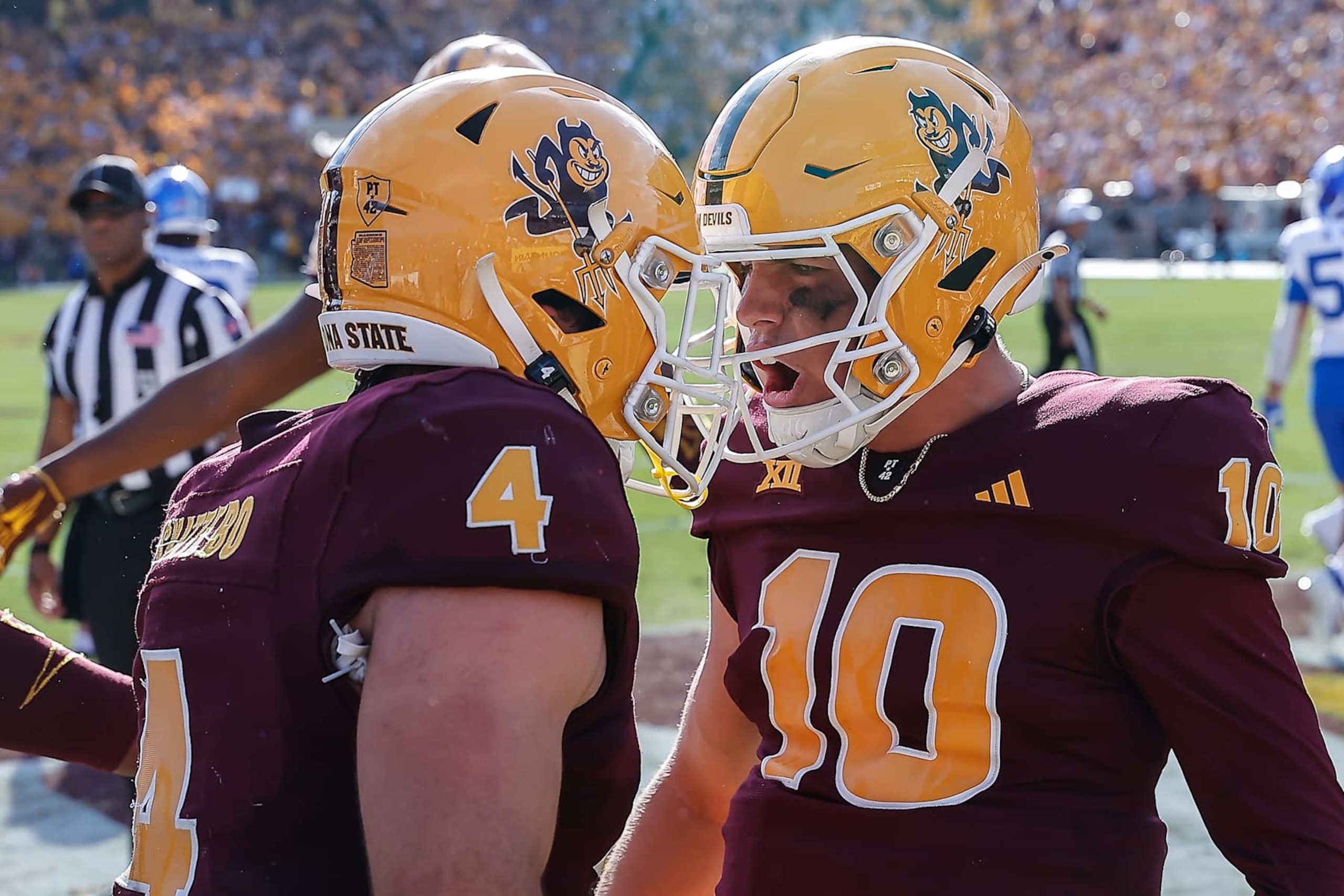 TEMPE, AZ - NOVEMBER 23:  Arizona State Sun Devils quarterback Sam Leavitt (10) and Arizona State Sun Devils running back Cam Skattebo (4) celebrate a touchdown during the college football game between the BYU Cougars and the Arizona State Sun Devils on November 23, 2024 at Mountain America Stadium in Tempe, Arizona. (Photo by Kevin Abele/Icon Sportswire via Getty Images)