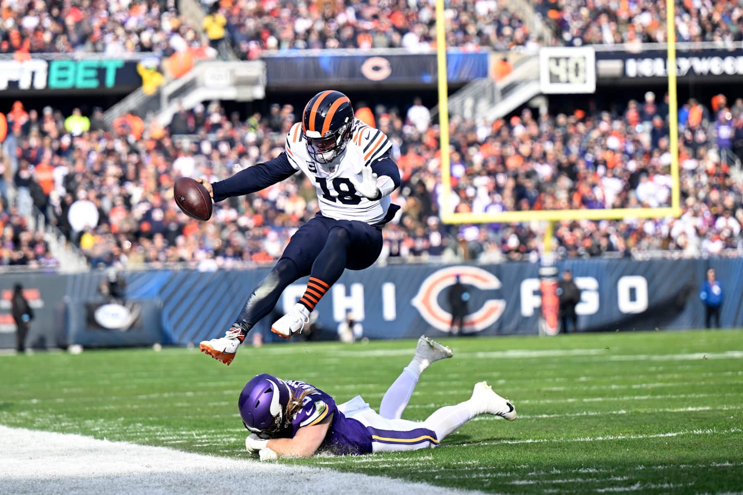 CHICAGO, ILLINOIS - NOVEMBER 24: Caleb Williams #18 of the Chicago Bears is forced out of bounds during the first quarter against the Minnesota Vikings at Soldier Field on November 24, 2024 in Chicago, Illinois. (Photo by Quinn Harris/Getty Images)