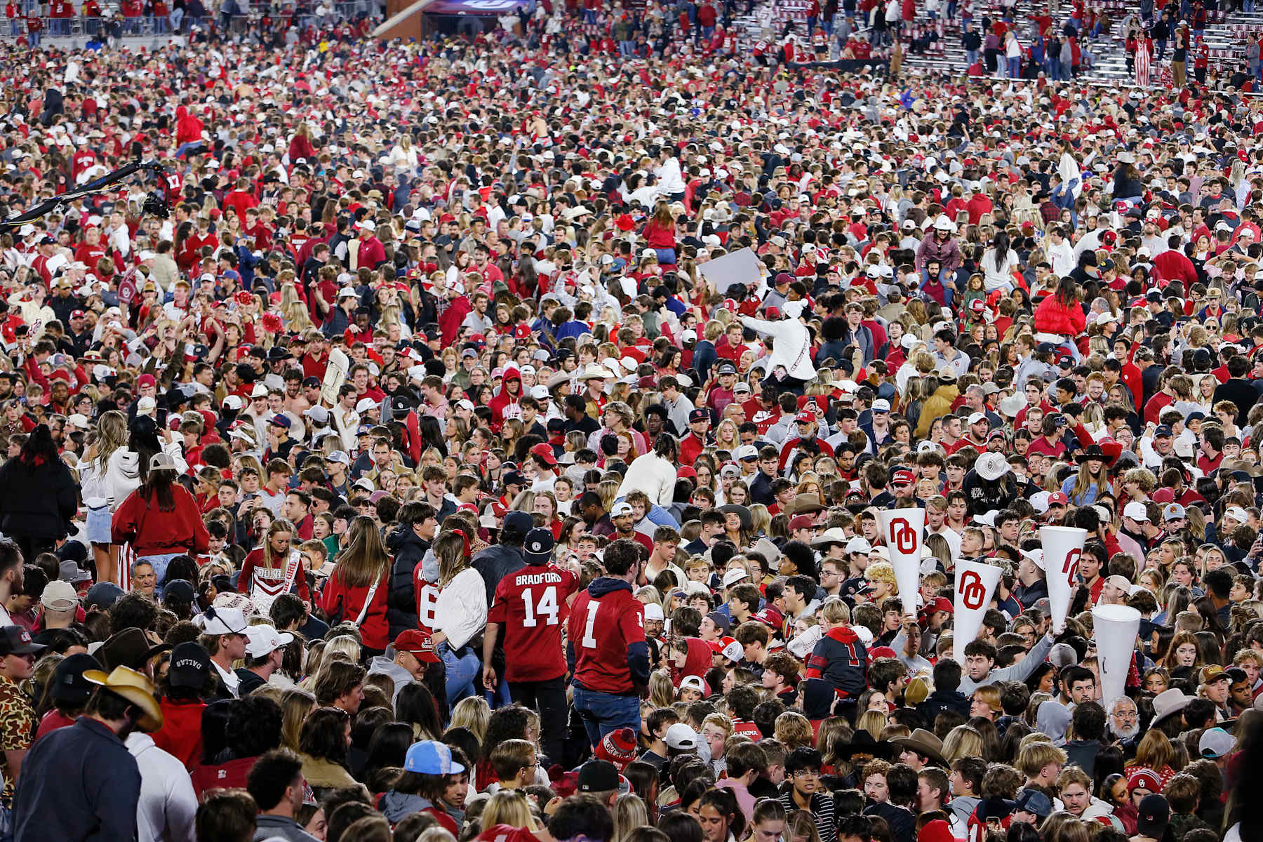 NORMAN, OKLAHOMA - NOVEMBER 23:  Oklahoma Sooners fans storm the field after the Oklahoma Sooners defeated the Alabama Crimson Tide 24-3 at Gaylord Family Oklahoma Memorial Stadium on November 23, 2024 in Norman, Oklahoma.  Oklahoma won 24-3. (Photo by Brian Bahr/Getty Images)