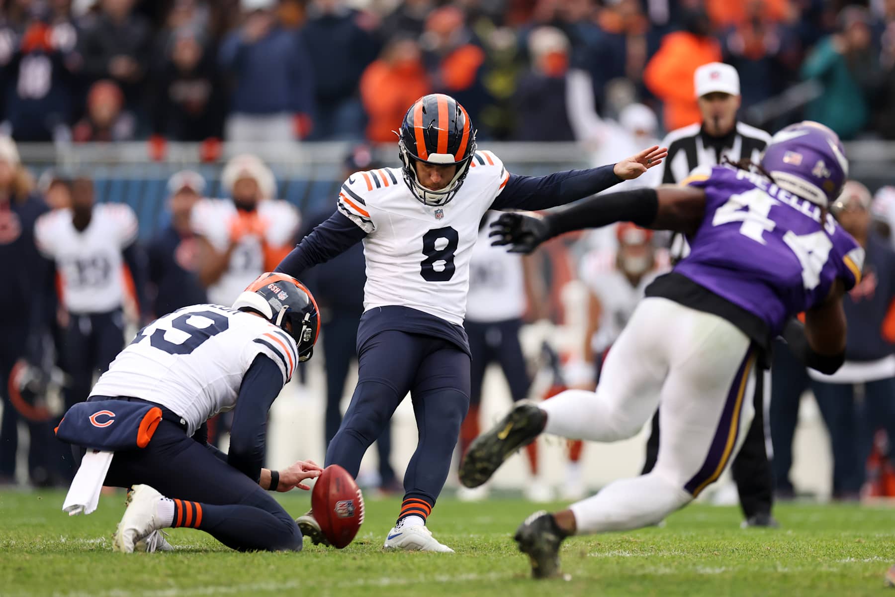 CHICAGO, ILLINOIS - NOVEMBER 24: Cairo Santos #8 of the Chicago Bears kicks a field goal to force overtime against the Minnesota Vikings at Soldier Field on November 24, 2024 in Chicago, Illinois. (Photo by Luke Hales/Getty Images)