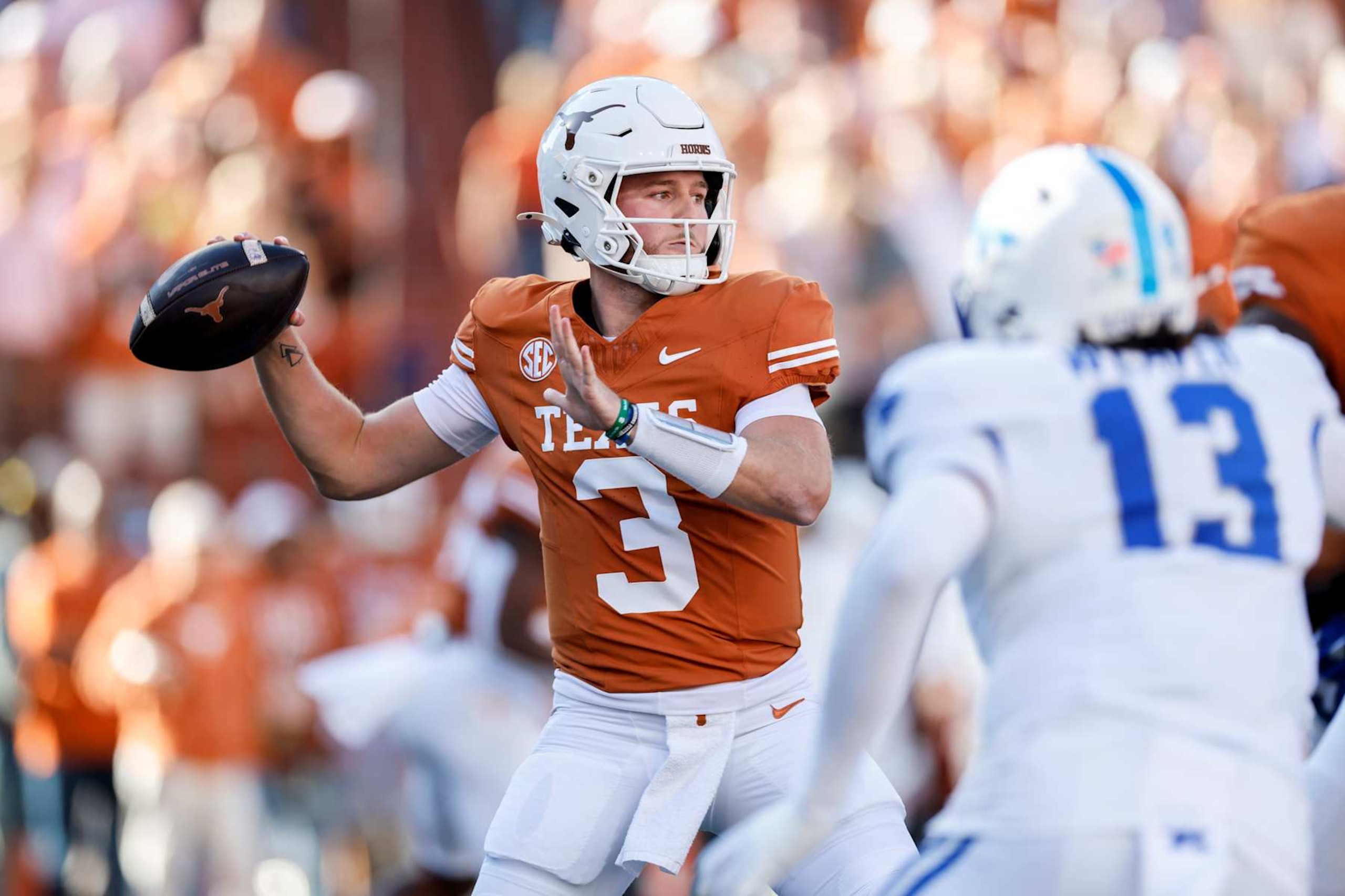 AUSTIN, TEXAS - NOVEMBER 23: Quinn Ewers #3 of the Texas Longhorns throws a pass in the first quarter against the Kentucky Wildcats at Darrell K Royal-Texas Memorial Stadium on November 23, 2024 in Austin, Texas. (Photo by Tim Warner/Getty Images) AUSTIN, TEXAS - NOVEMBER 23: Quinn Ewers #3 of the Texas Longhorns throws a pass in the first quarter against the Kentucky Wildcats at Darrell K Royal-Texas Memorial Stadium on November 23, 2024 in Austin, Texas. (Photo by Tim Warner/Getty Images)