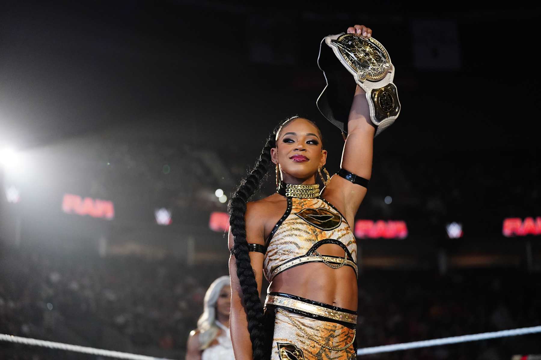 PORTLAND, OREGON - SEPTEMBER 16: Bianca Belair holds the WWE Women's Tag Team Championship during Monday Night RAW at Moda Center on September 16, 2024 in Portland, Oregon.  (Photo by WWE/Getty Images)