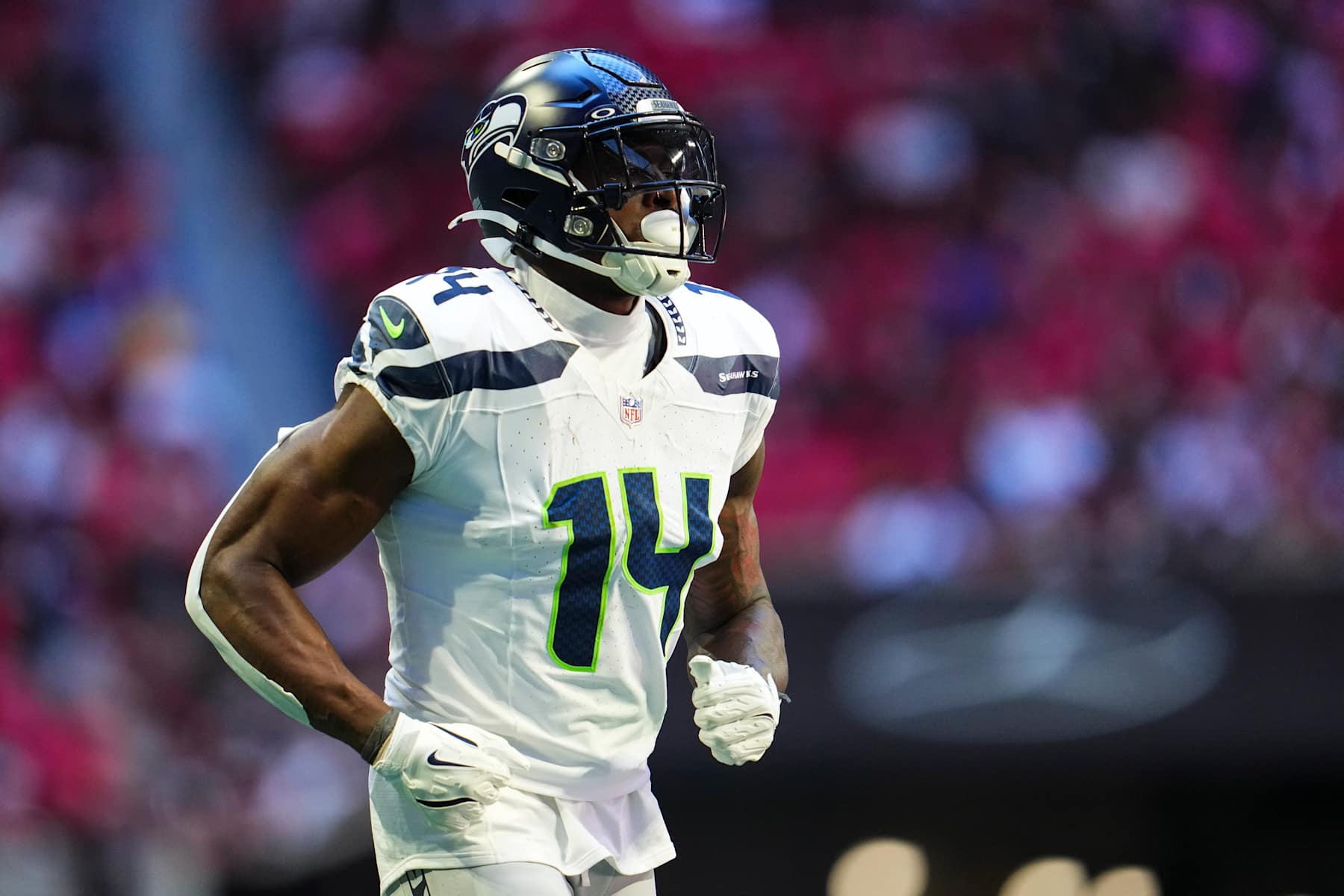ATLANTA, GA - OCTOBER 20: DK Metcalf #14 of the Seattle Seahawks looks on from the field during an NFL football game against the Atlanta Falcons at Mercedes-Benz Stadium on October 20, 2024 in Atlanta, Georgia. (Photo by Cooper Neill/Getty Images)