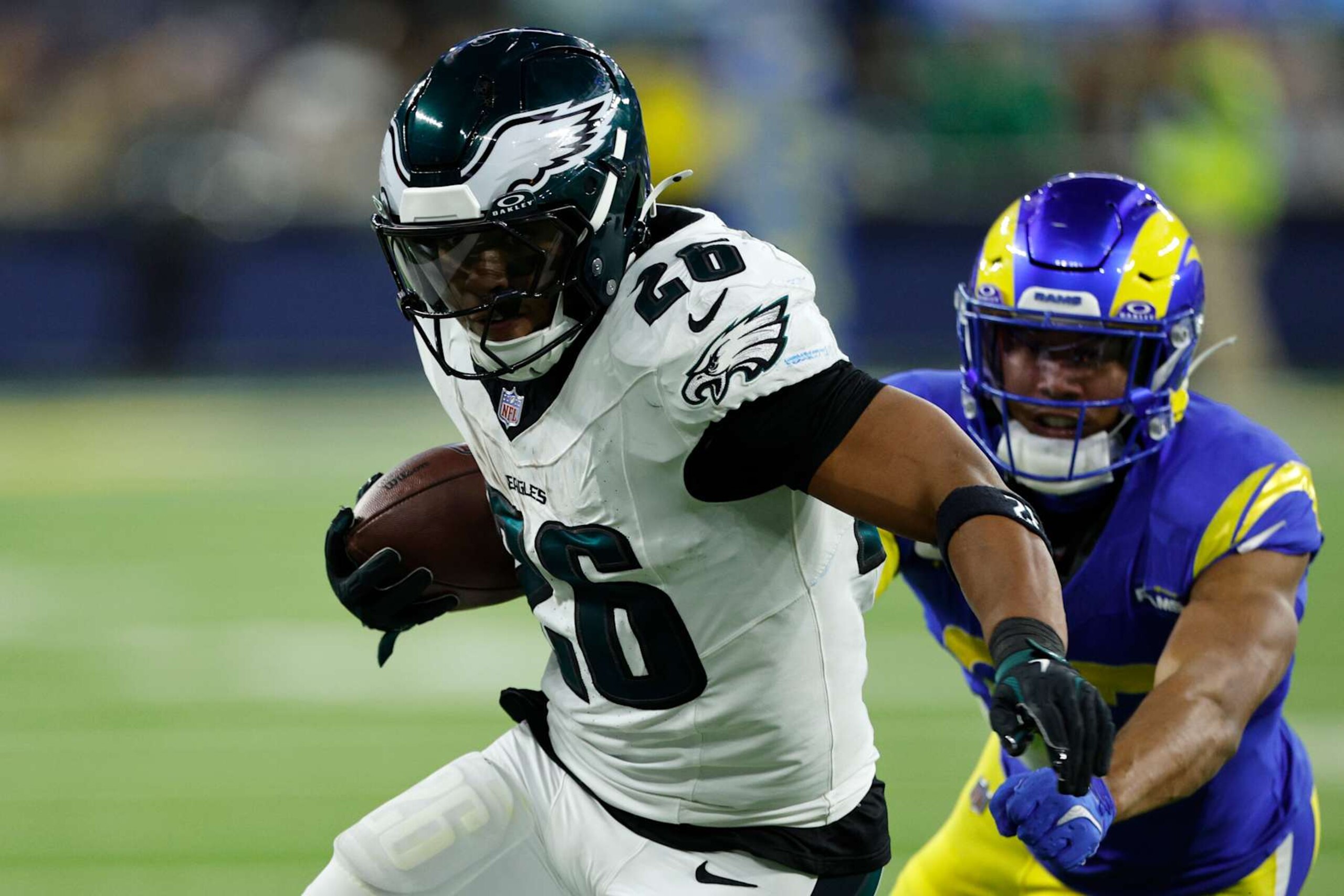 INGLEWOOD, CALIFORNIA - NOVEMBER 24: Saquon Barkley #26 of the Philadelphia Eagles runs with the ball during the fourth quarter against the Los Angeles Rams at SoFi Stadium on November 24, 2024 in Inglewood, California. (Photo by Kevork Djansezian/Getty Images)