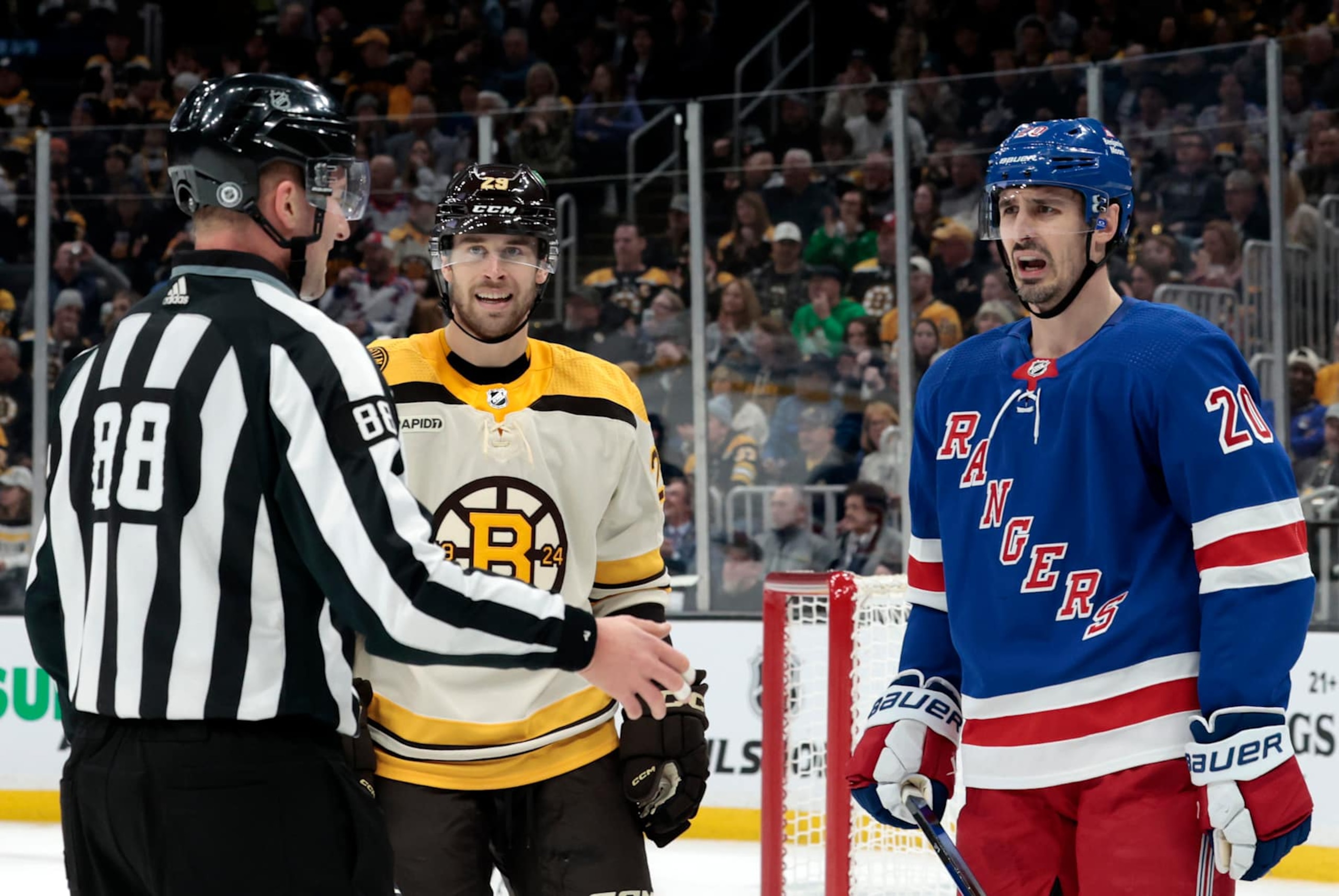 BOSTON, MA - DECEMBER 16: New York Rangers left wing Chris Kreider (20) reacts to linesman Tyson Baker (88) during a game between the Boston Bruins and the New York Rangers on December 16, 2023, at TD Garden in Boston, Massachusetts. (Photo by Fred Kfoury III/Icon Sportswire via Getty Images)